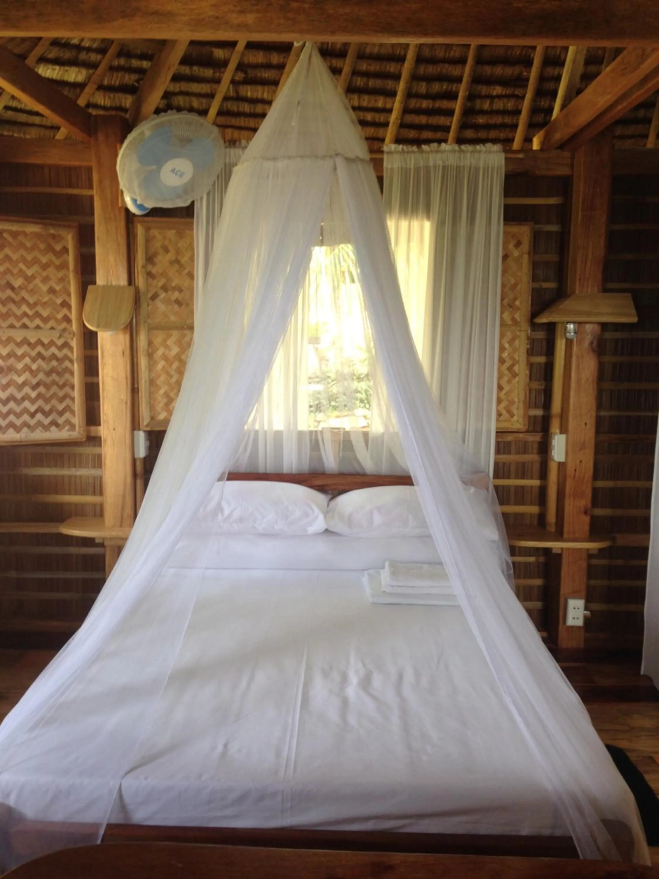 Bed in Tinaoog Beach Resort