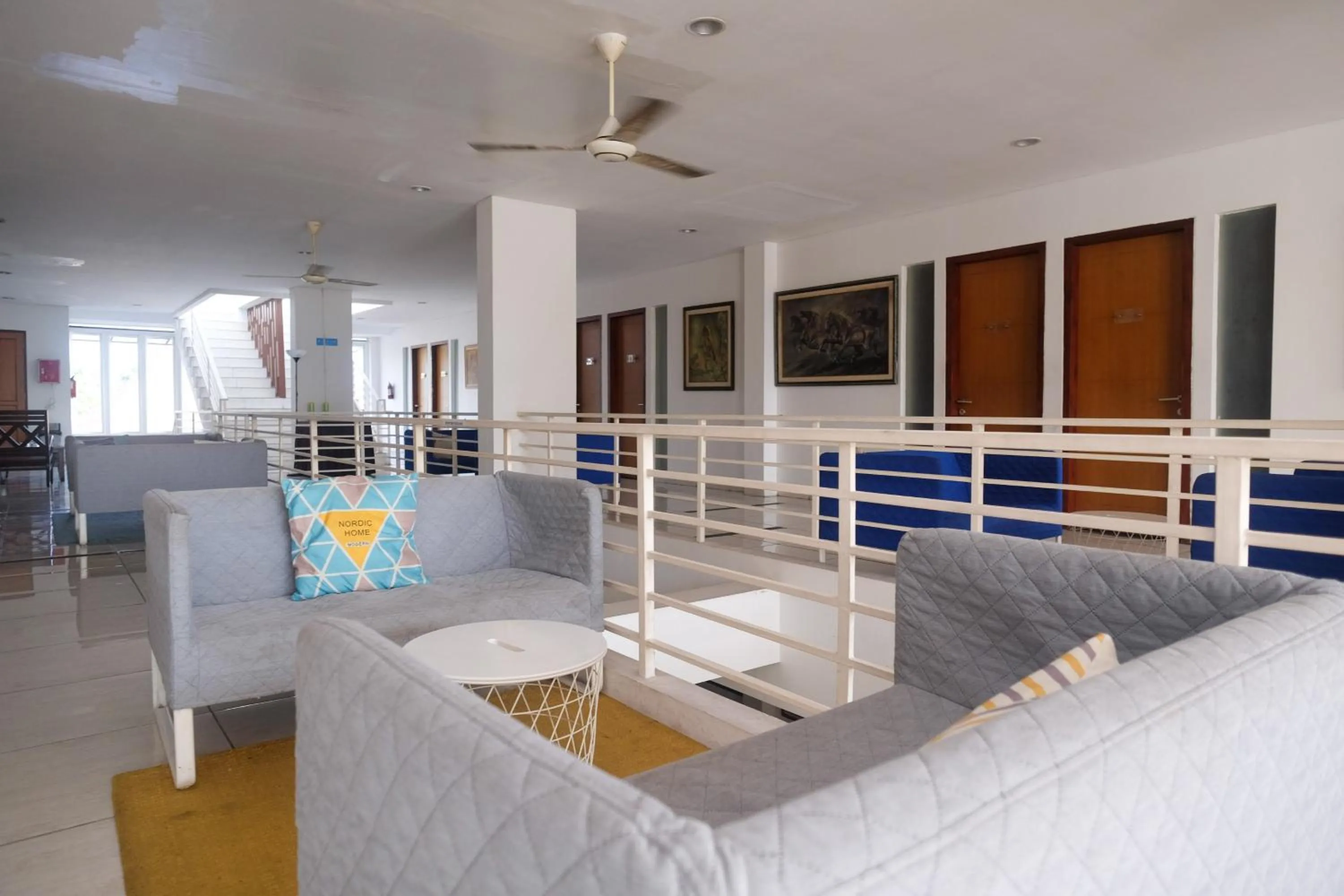 Seating area, Bed in Sans Hotel Prime Cailendra Yogyakarta by RedDoorz