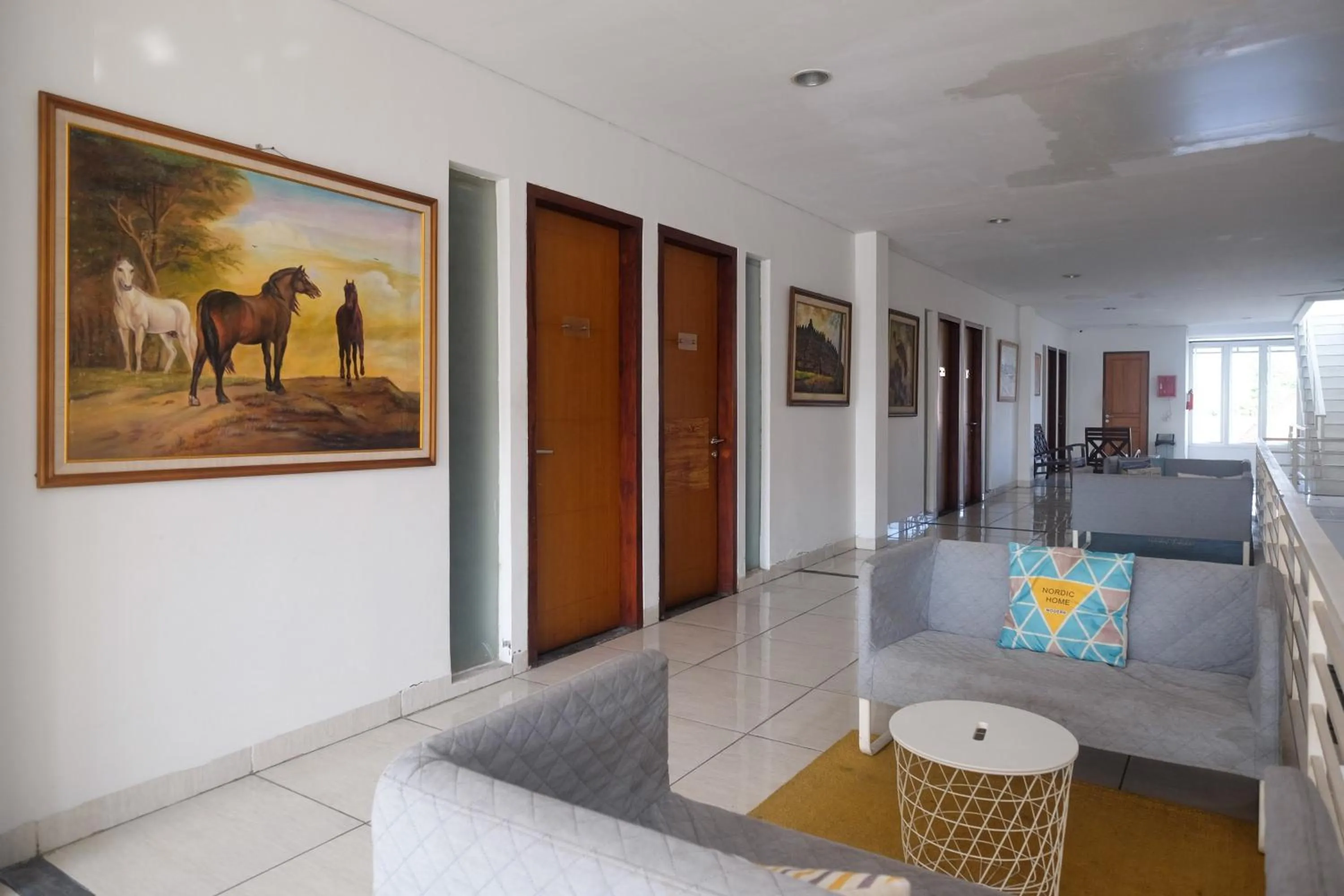 Seating area, Bed in Sans Hotel Prime Cailendra Yogyakarta by RedDoorz