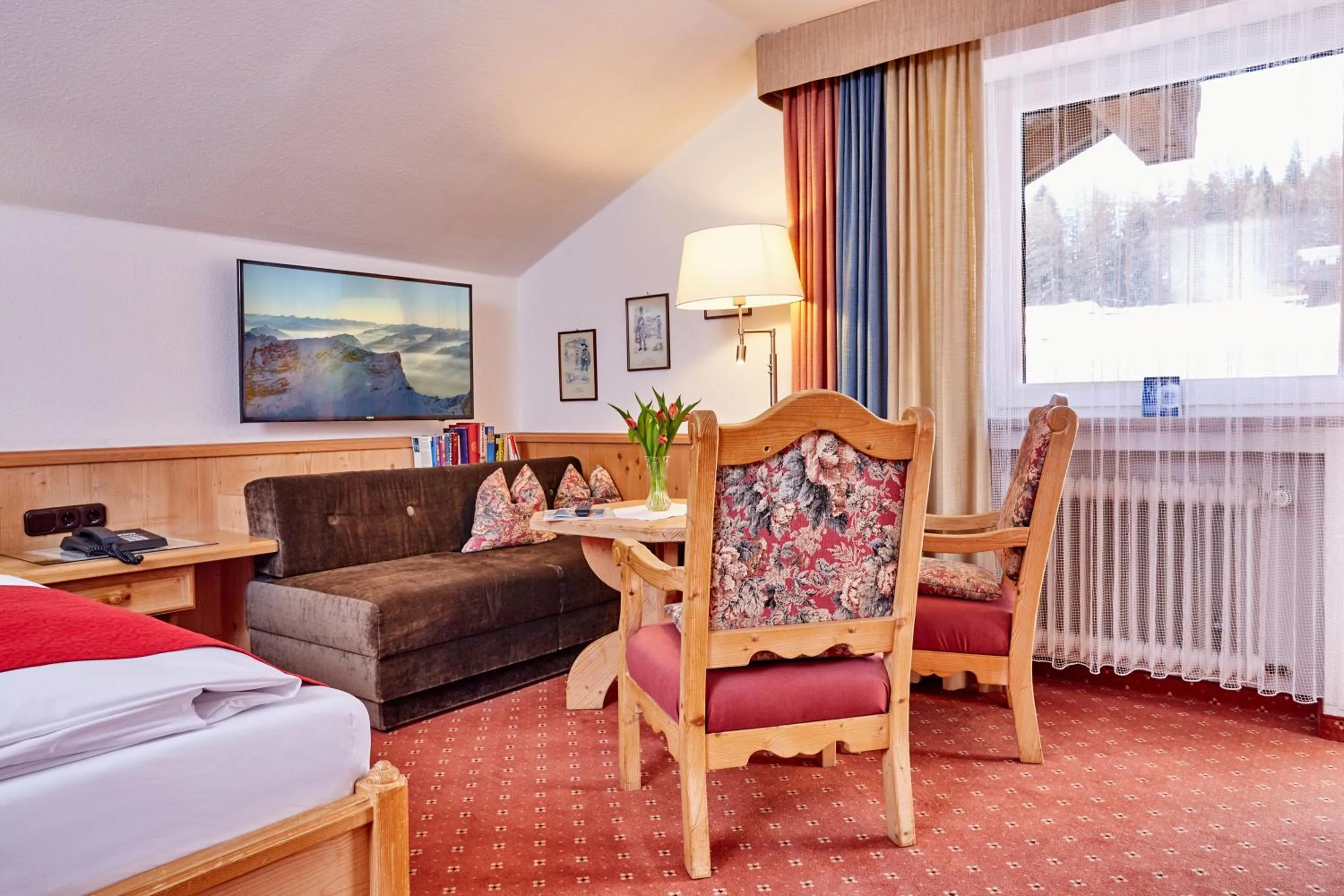 Seating area, Bed in Hotel Franziska