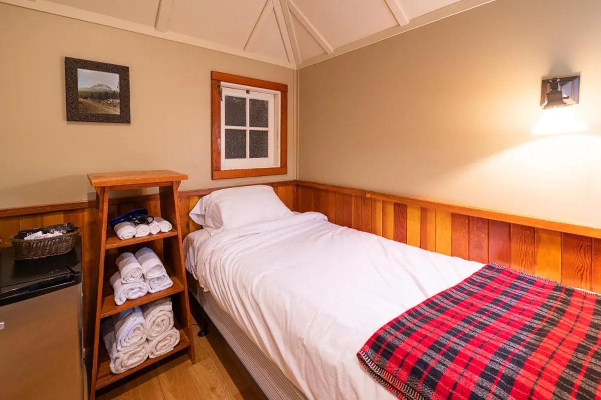 Bed in Johnston Canyon Lodge & Bungalows
