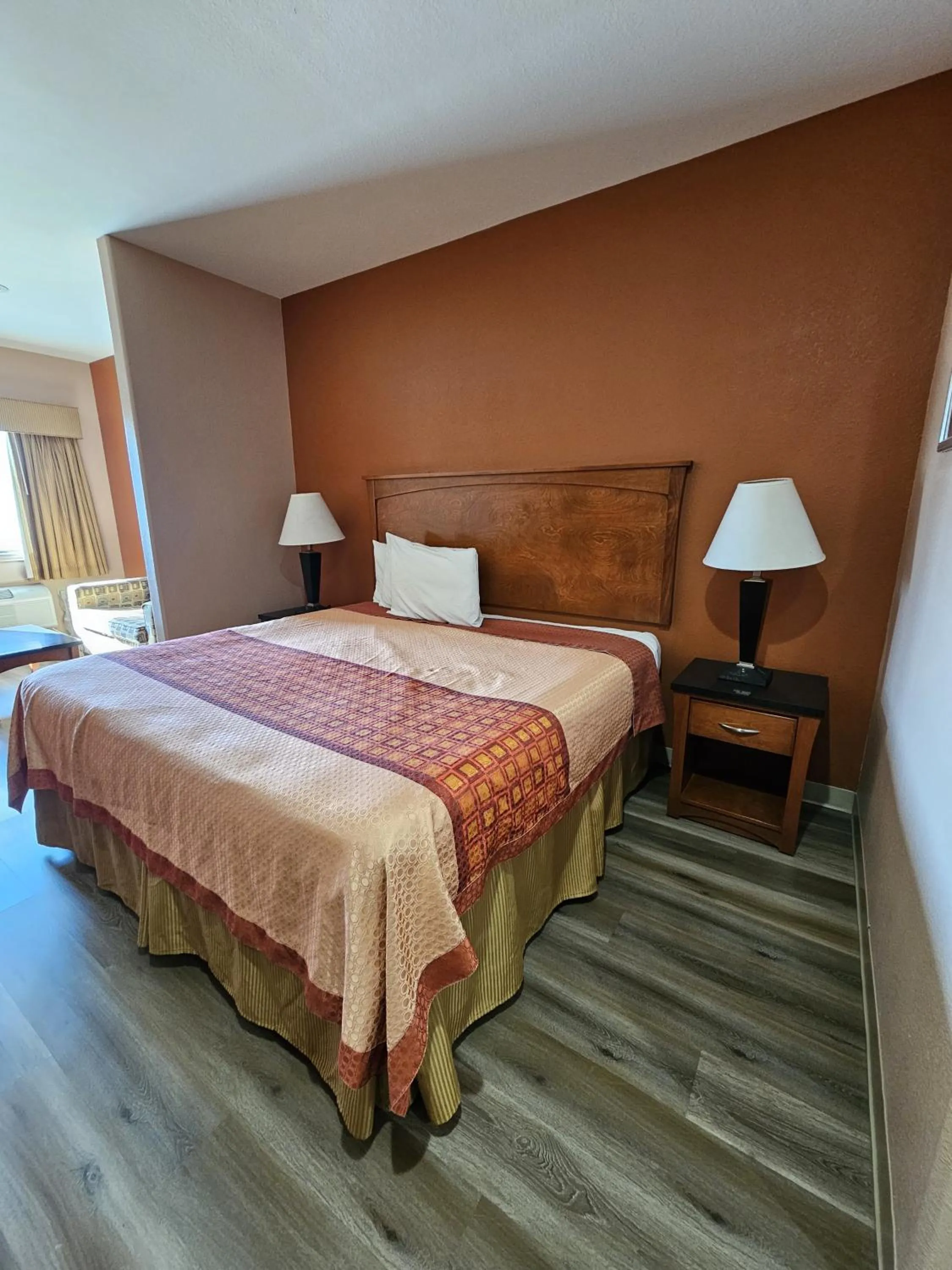 Bed in Budgetel Inn and Suites