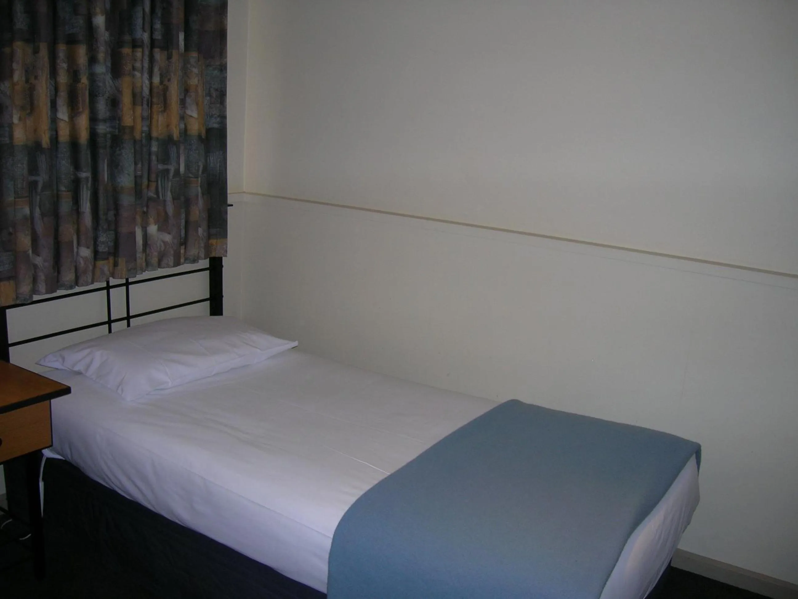 Bed in Overlander Hotel Motel