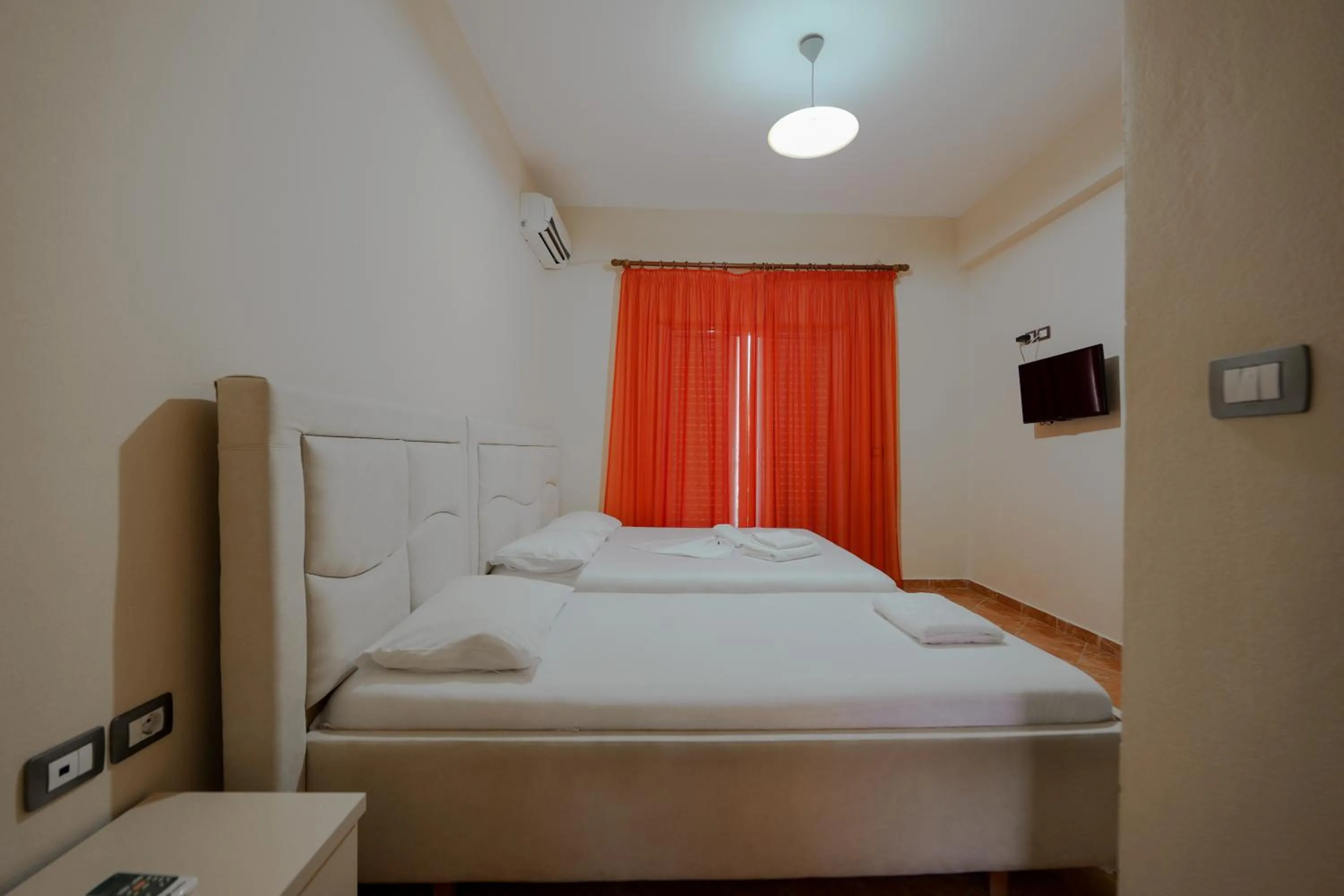 Bed in Unico ApartHotel