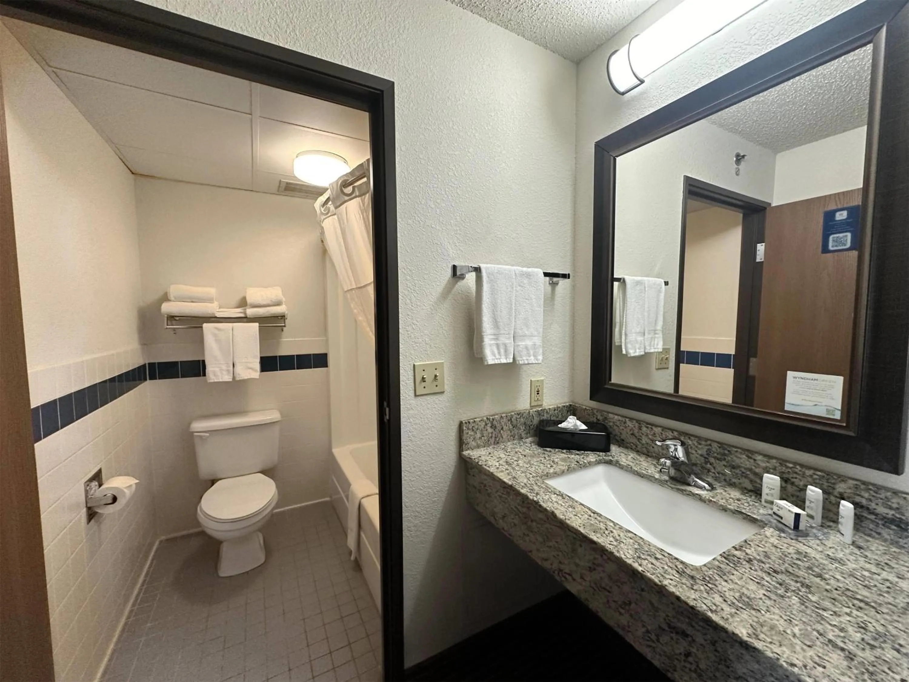 Bathroom in AmericInn by Wyndham Menominee