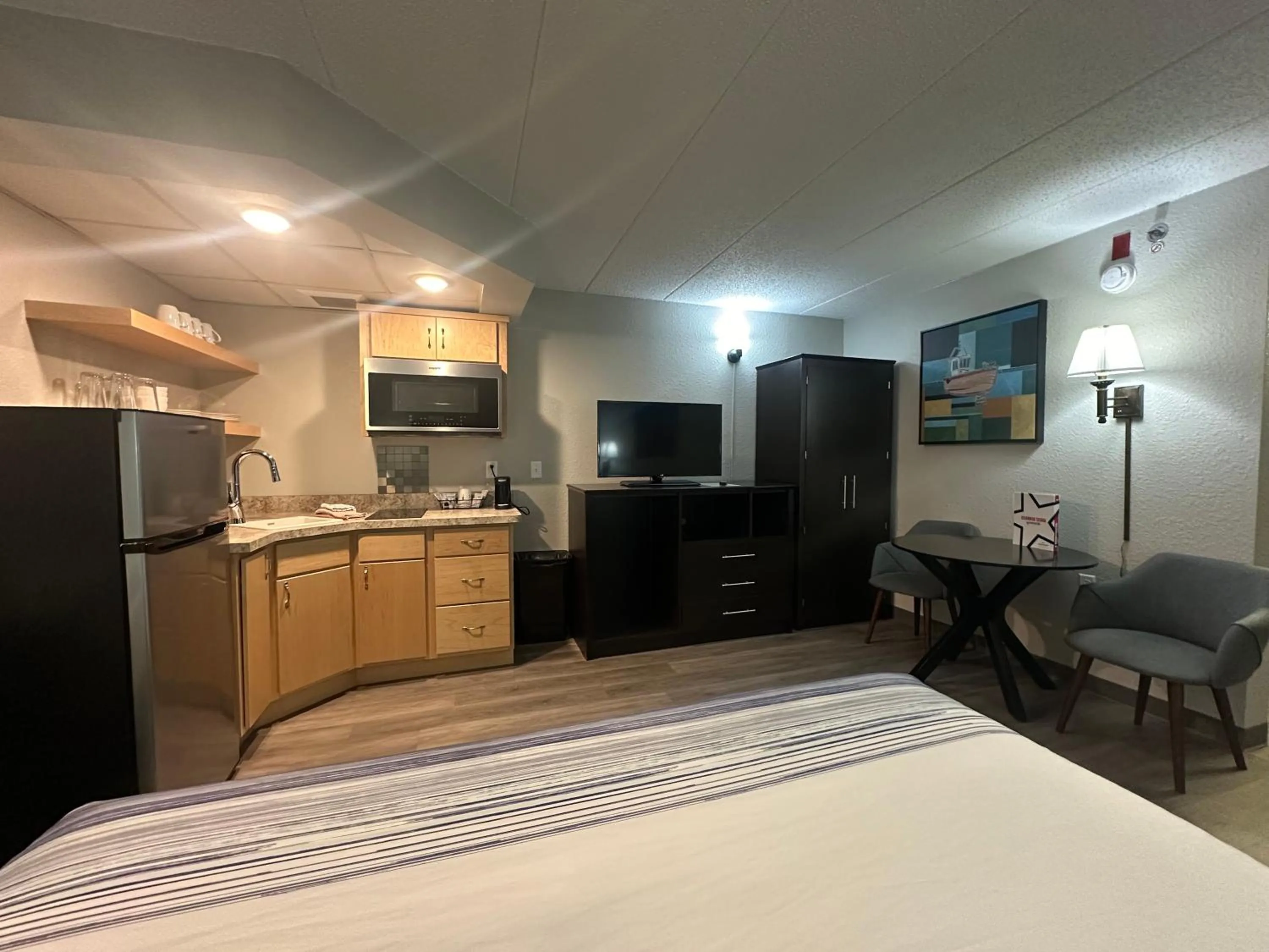 Bed in AmericInn by Wyndham Menominee