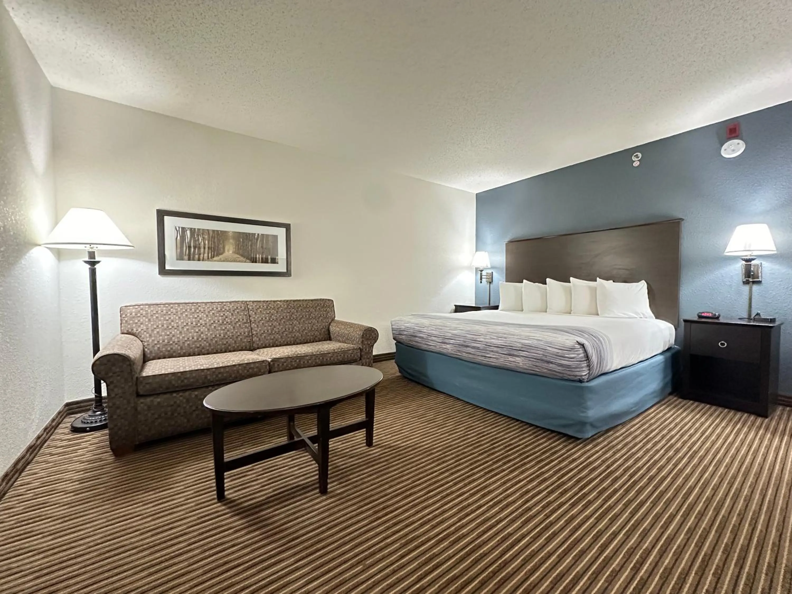 Bed in AmericInn by Wyndham Menominee
