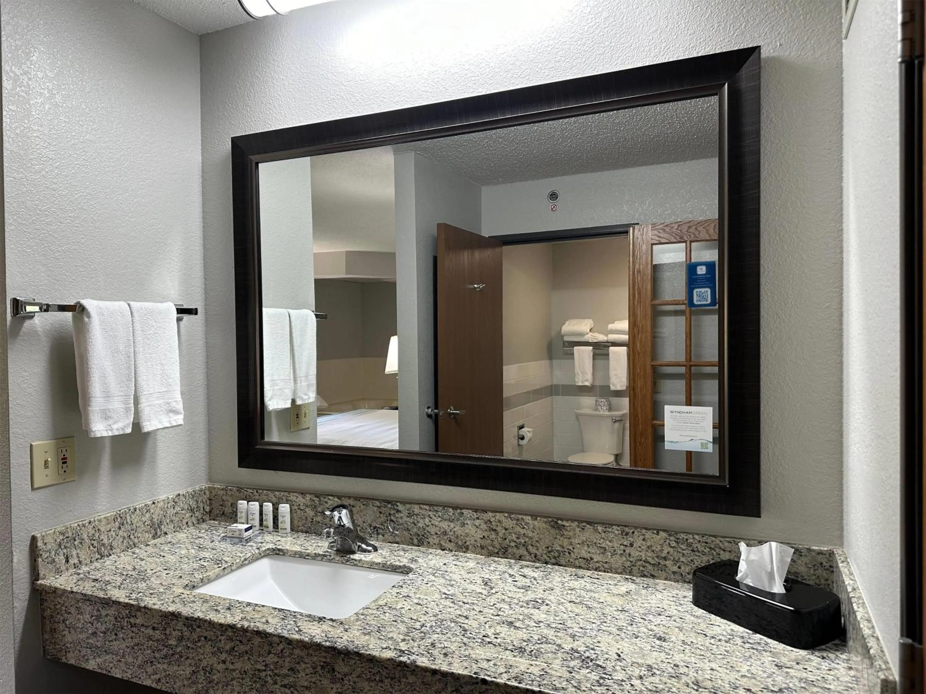 Bathroom in AmericInn by Wyndham Menominee