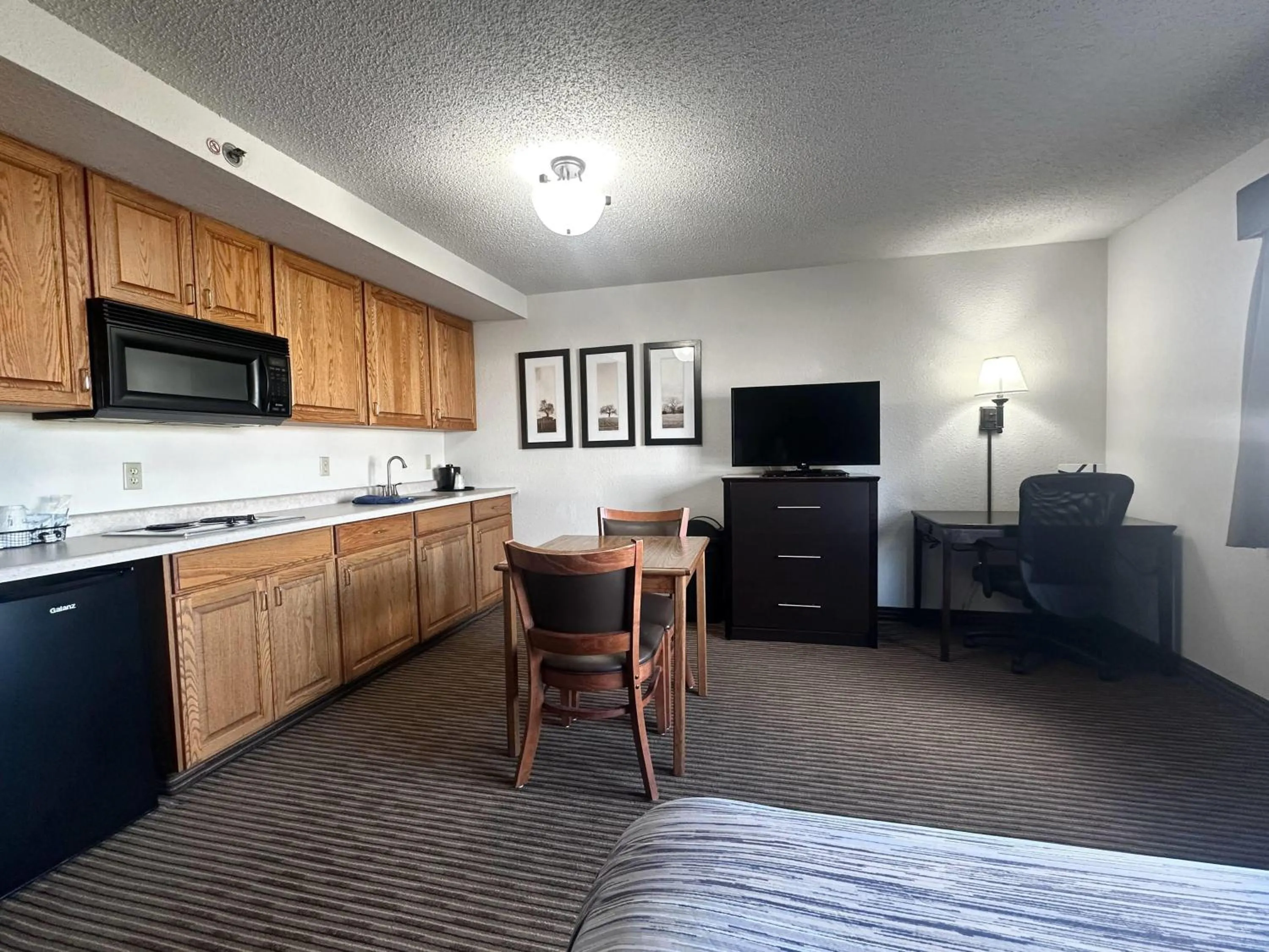 Photo of the whole room in AmericInn by Wyndham Menominee