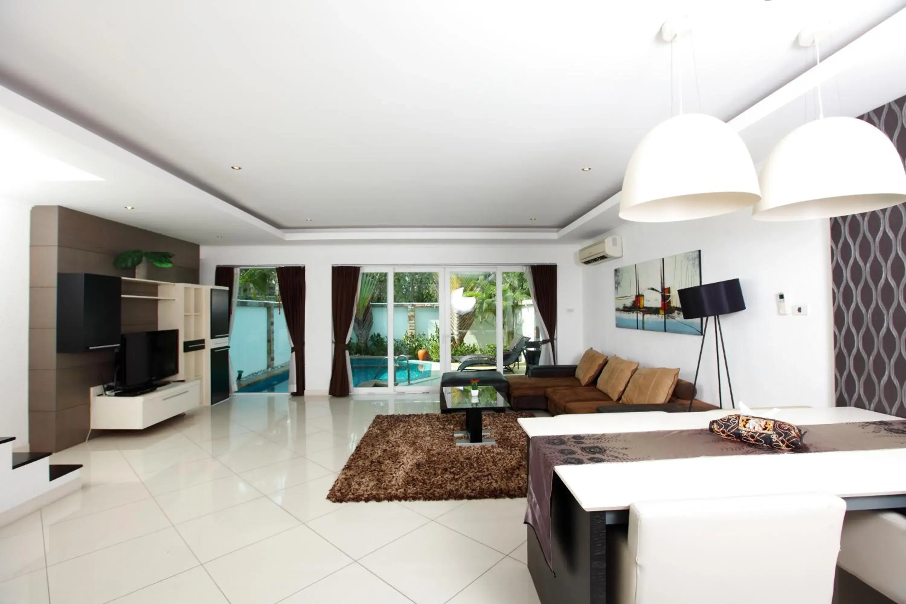 Living room, Kitchen/Kitchenette in Wongamat Pool Villas By Pattaya Sunny Rentals