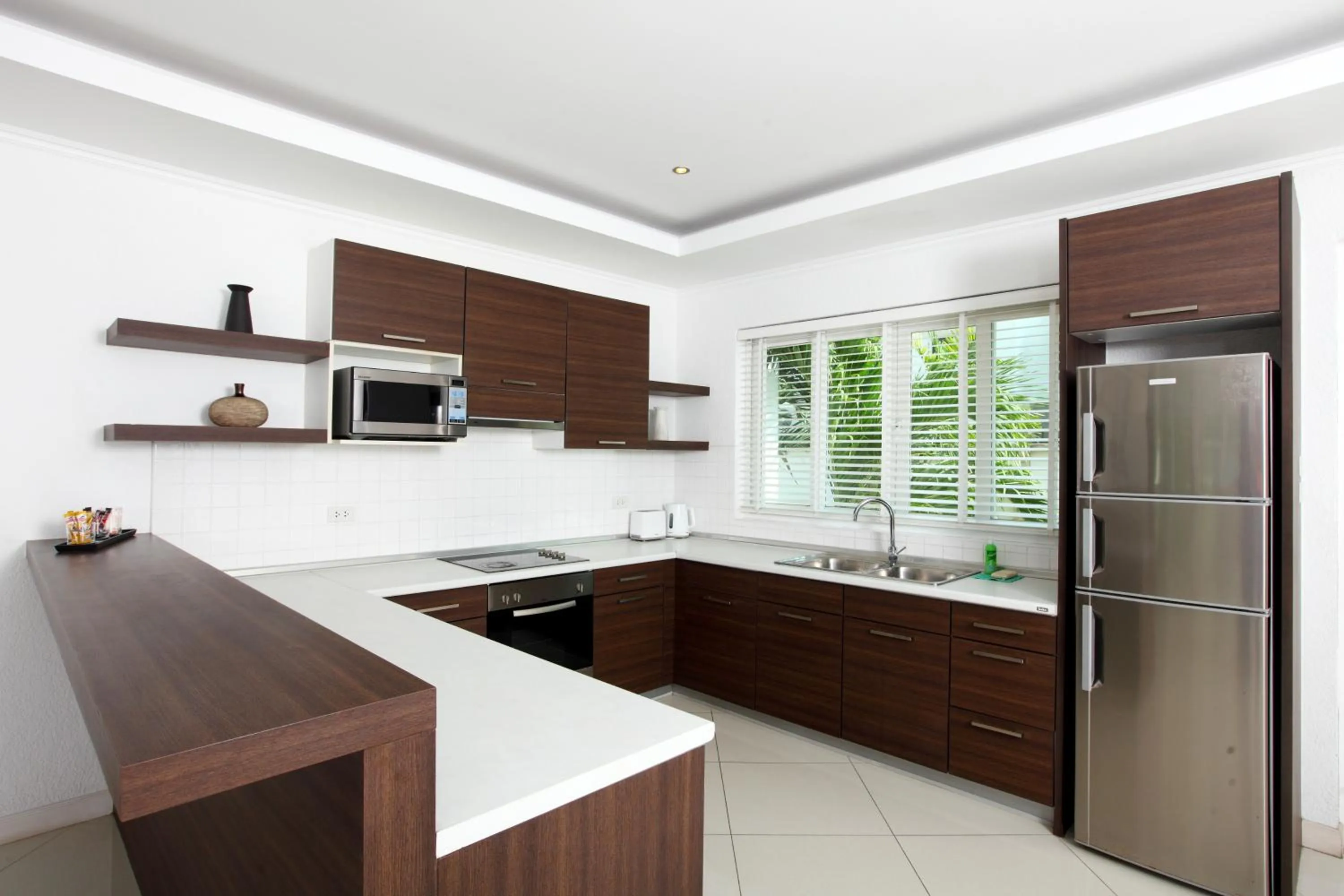 Kitchen or kitchenette in Wongamat Pool Villas By Pattaya Sunny Rentals