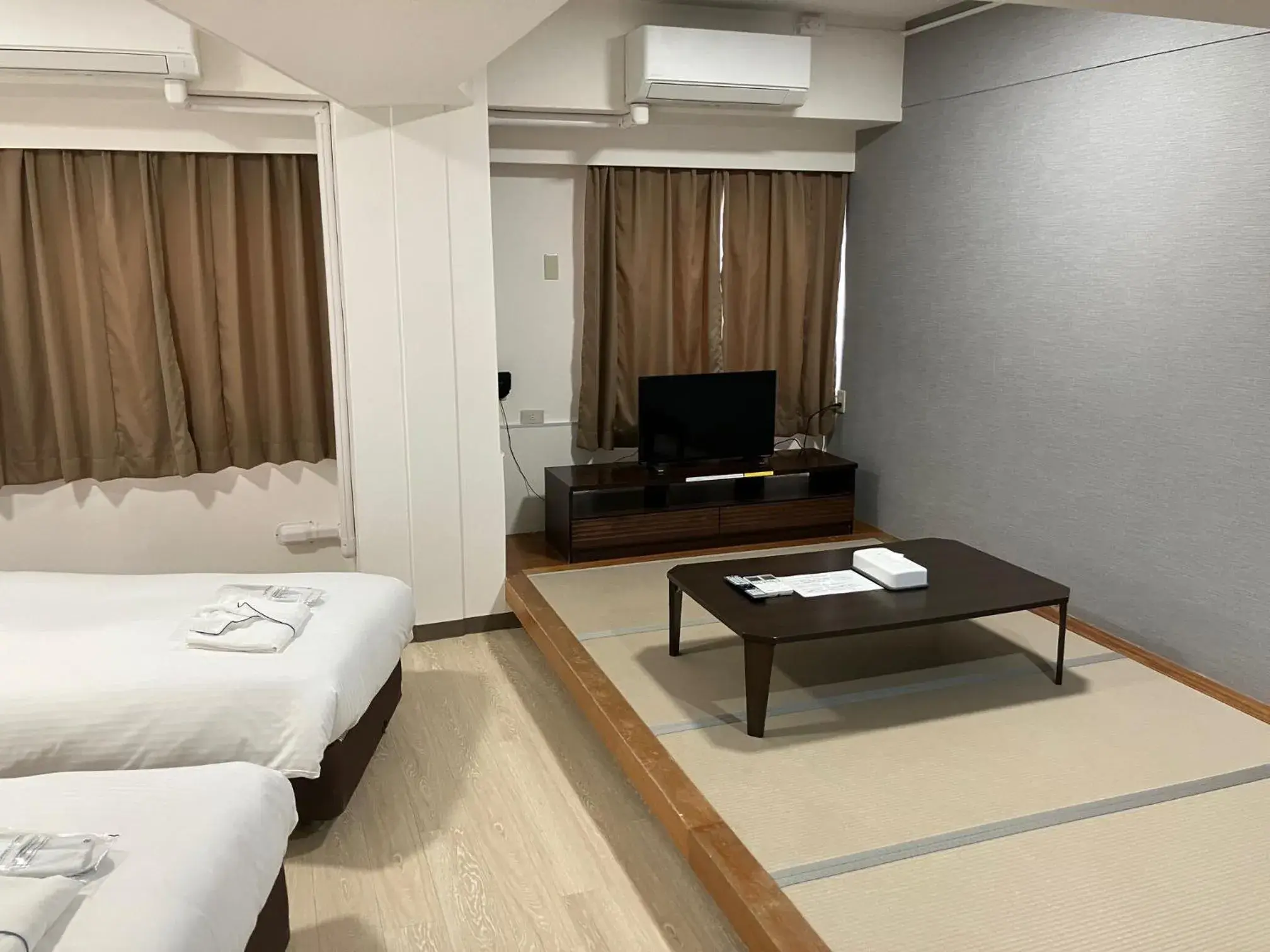 Bed in Enagic Okinawa Kokusai Plaza Hotel Bed in Enagic Okinawa Kokusai Plaza Hotel