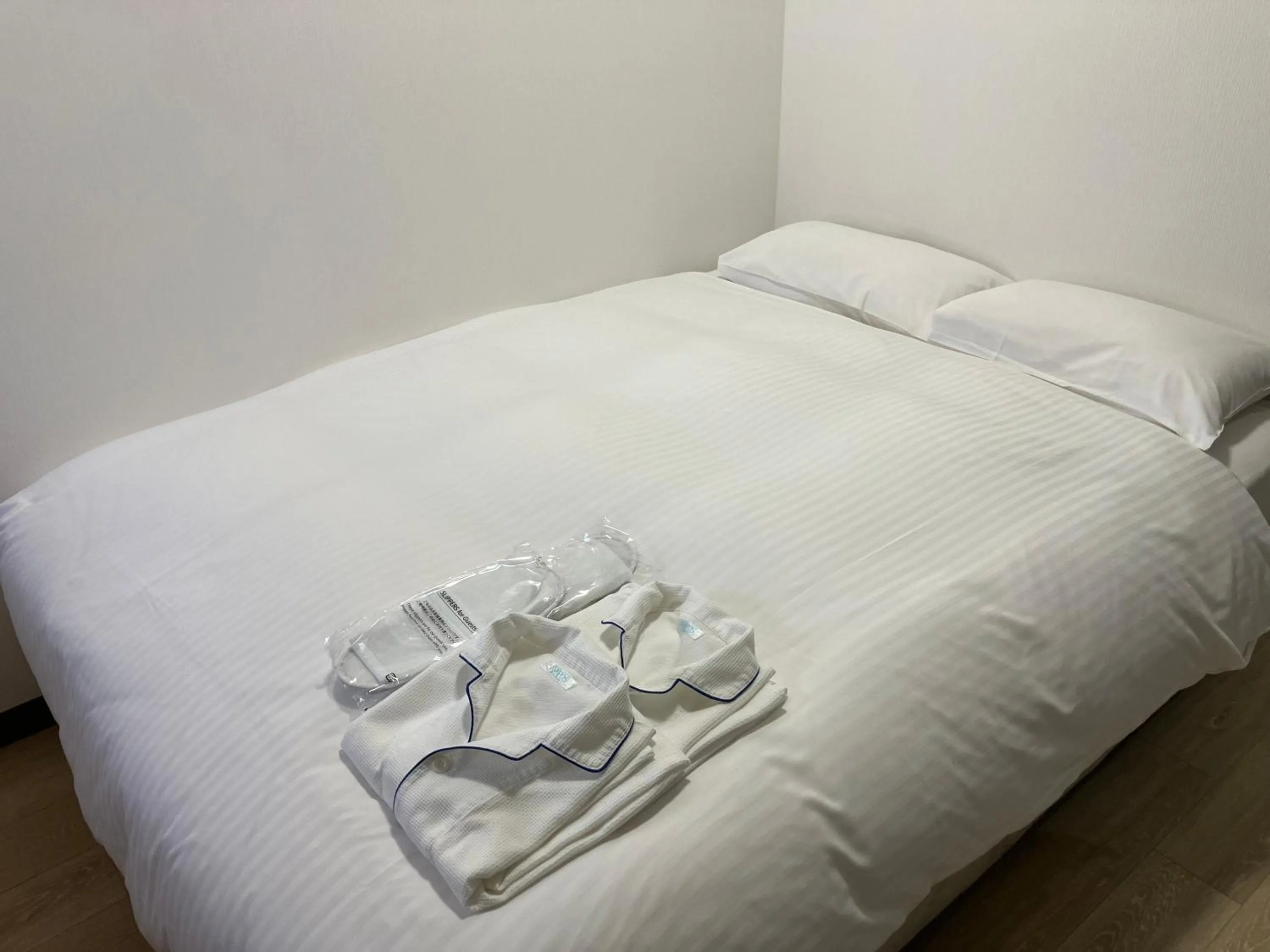 Bed in Enagic Okinawa Kokusai Plaza Hotel