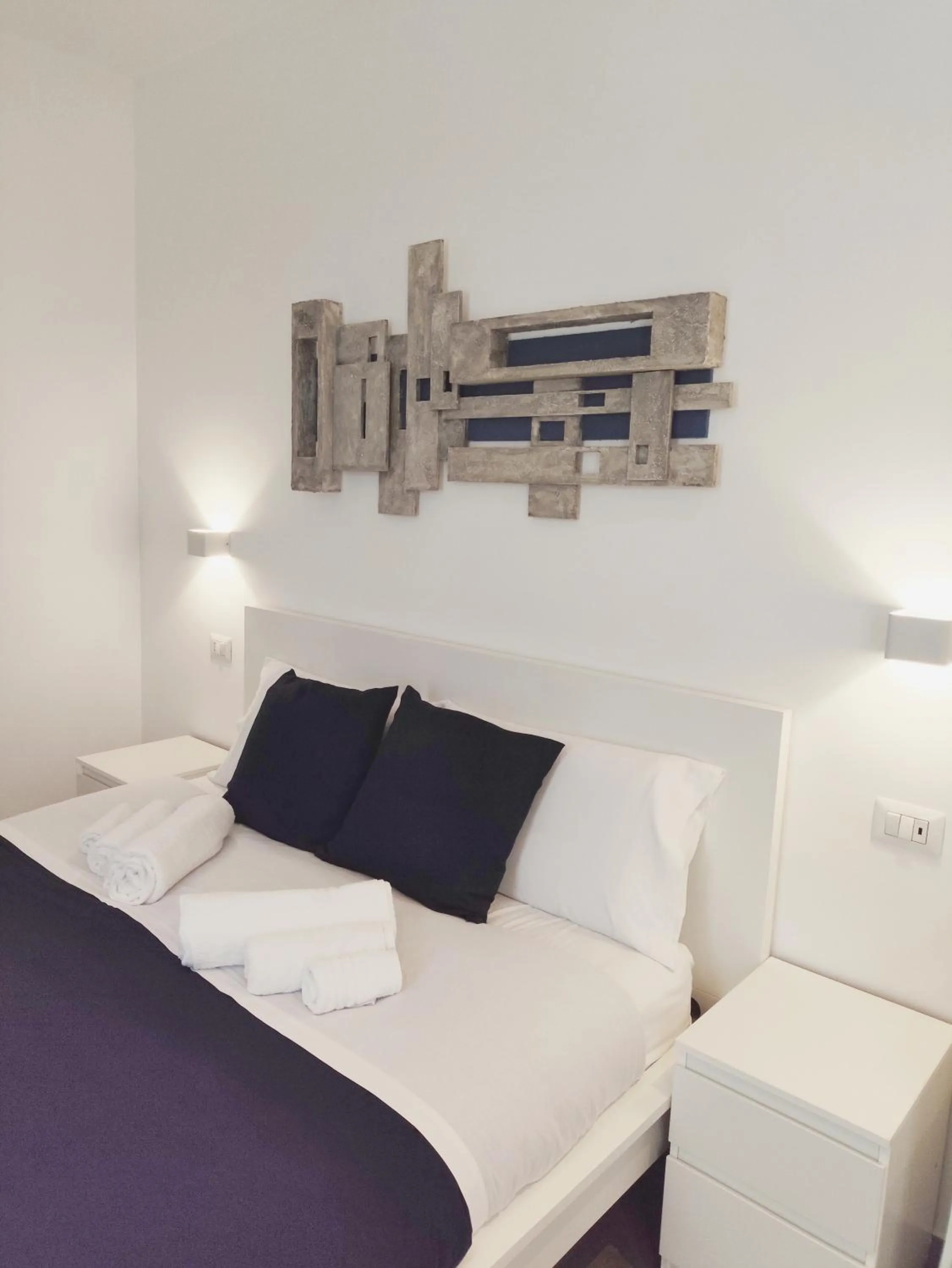 Bed in Palazzo Verdi Holiday Viterbo