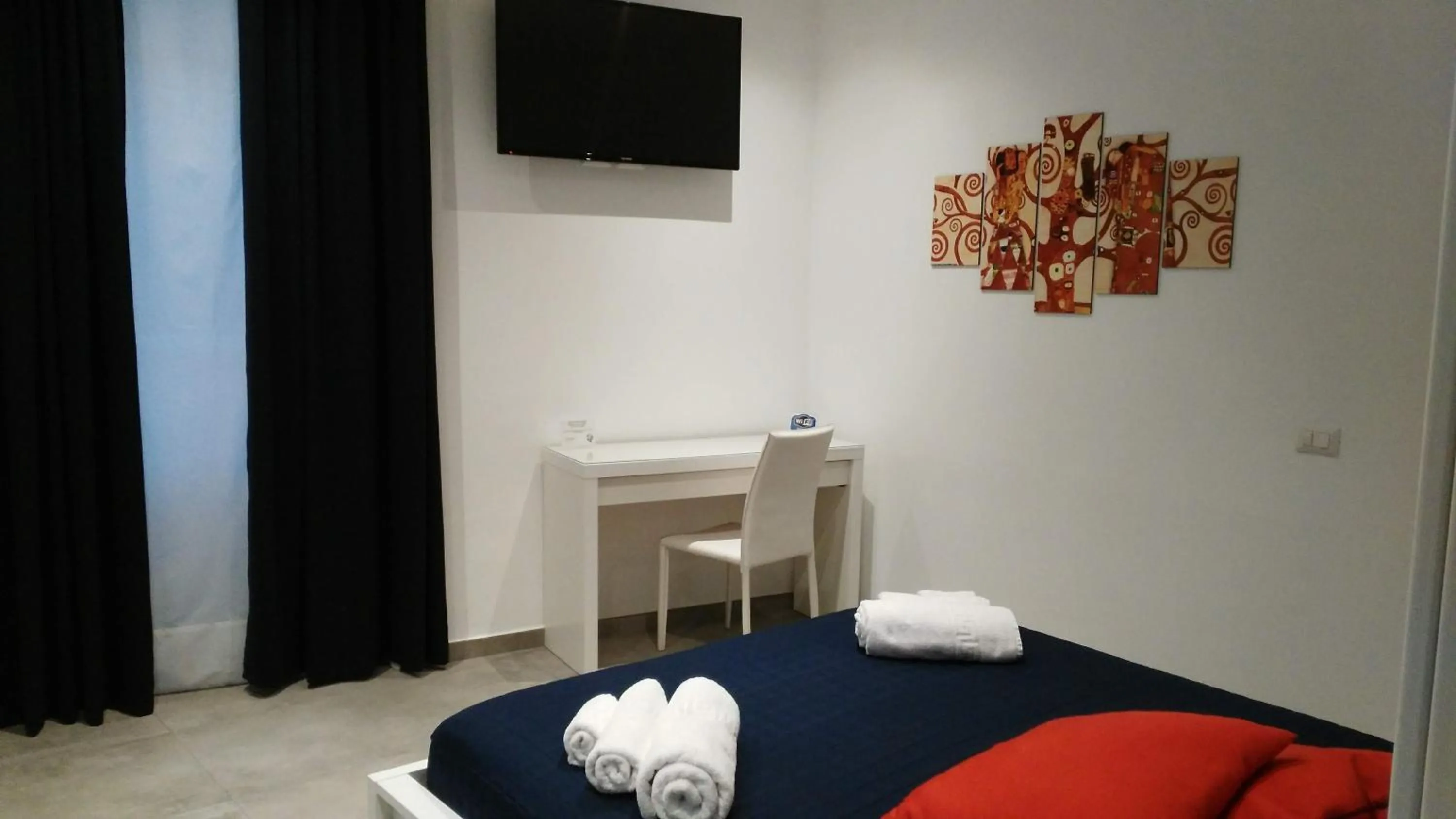 Bed in Palazzo Verdi Holiday Viterbo