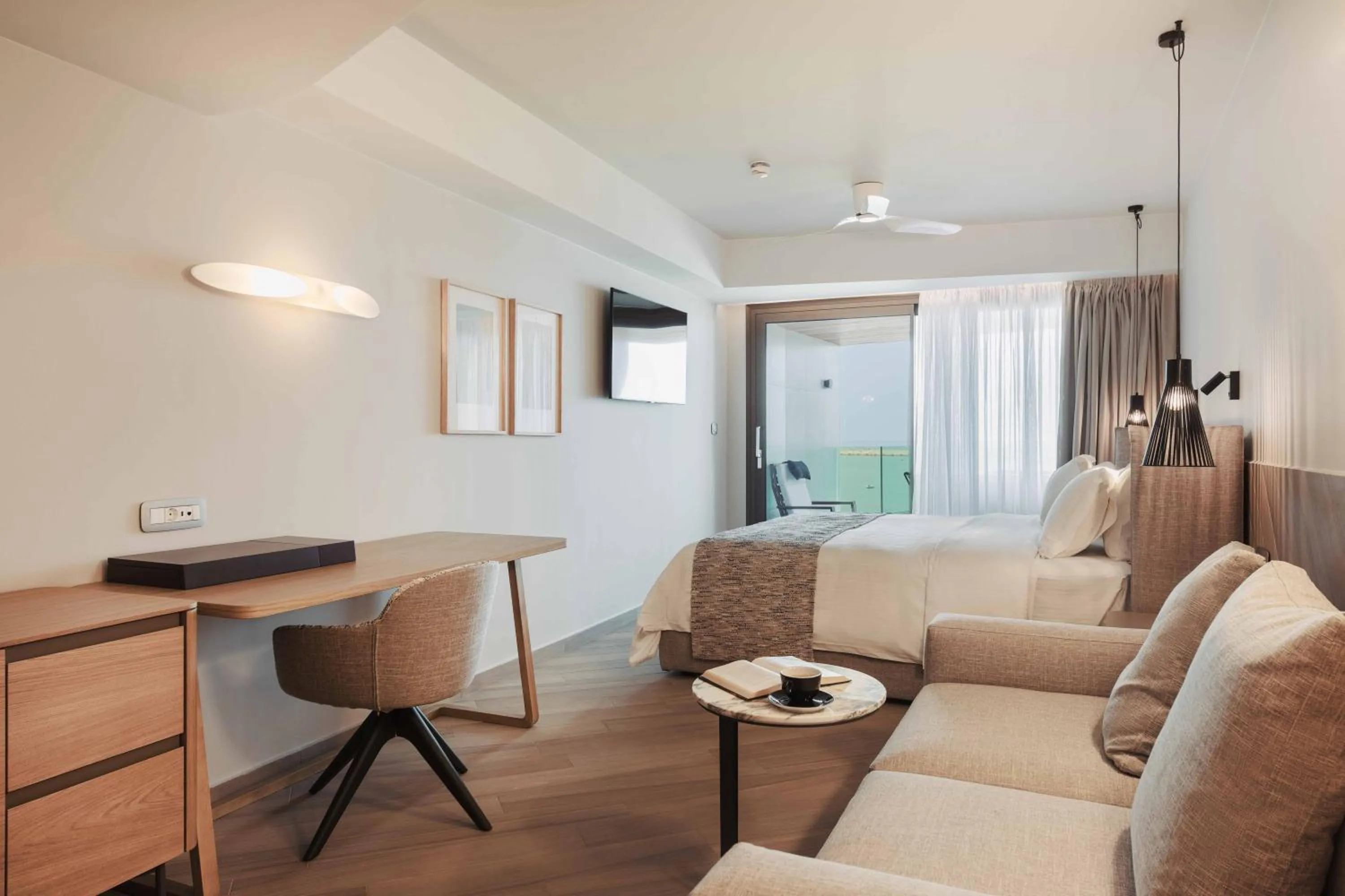 Seating area, Bed in BIO BEACH Boutique Hotel - Adults Only
