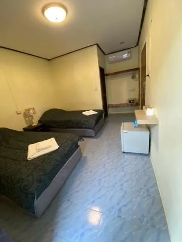 Bed in Baan Rom Mai Resort