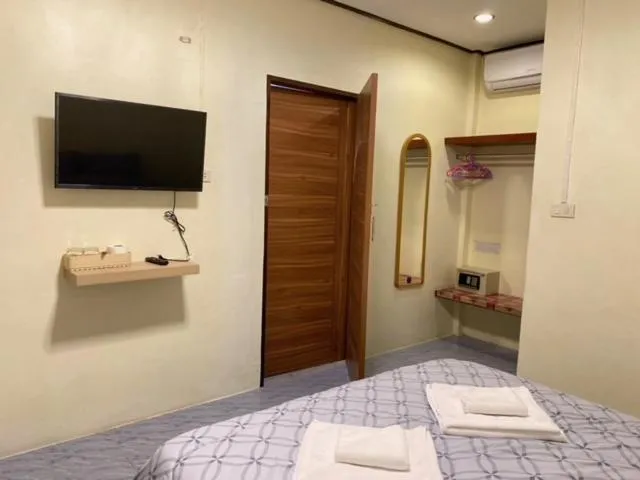 Bed in Baan Rom Mai Resort