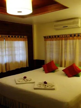 Bed in Baan Rom Mai Resort