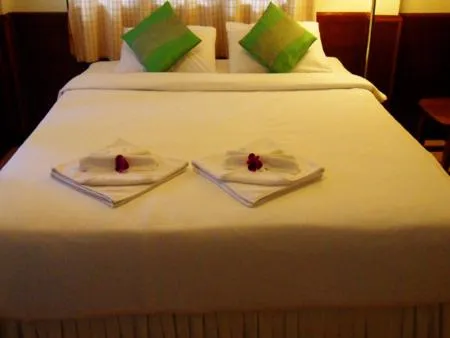 Bed in Baan Rom Mai Resort