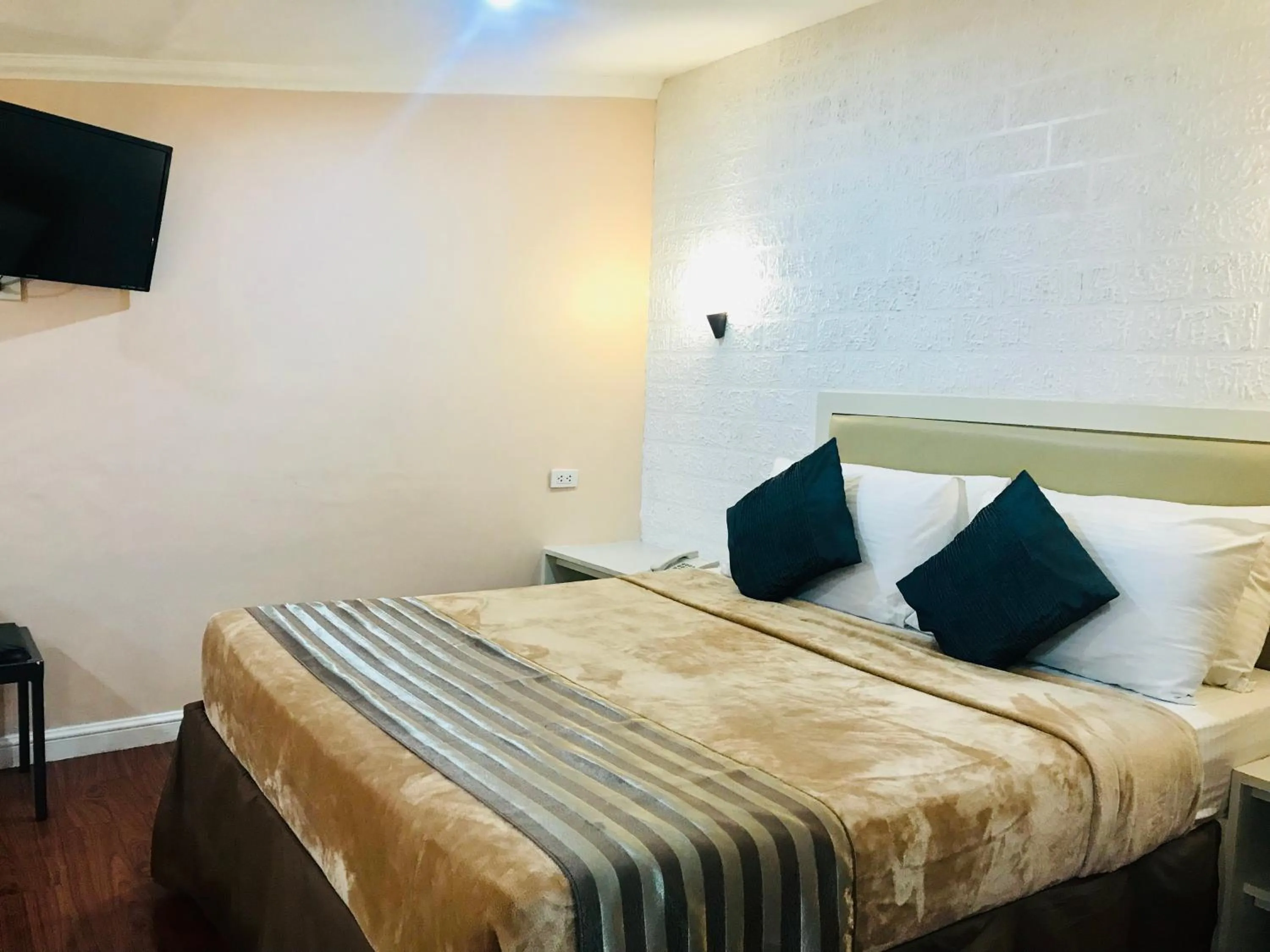 Bed in Urban Travellers Hotel