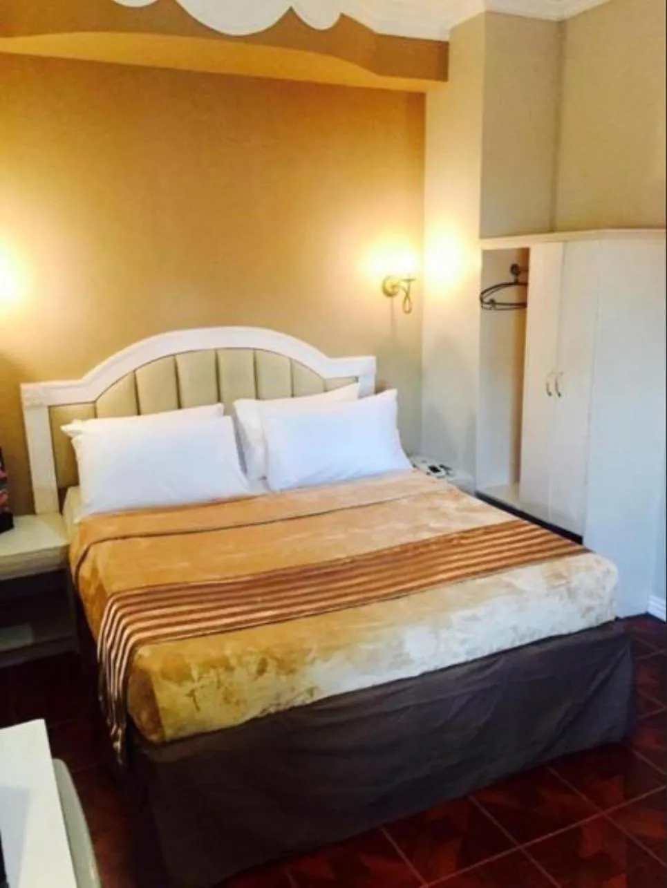 Bed in Urban Travellers Hotel