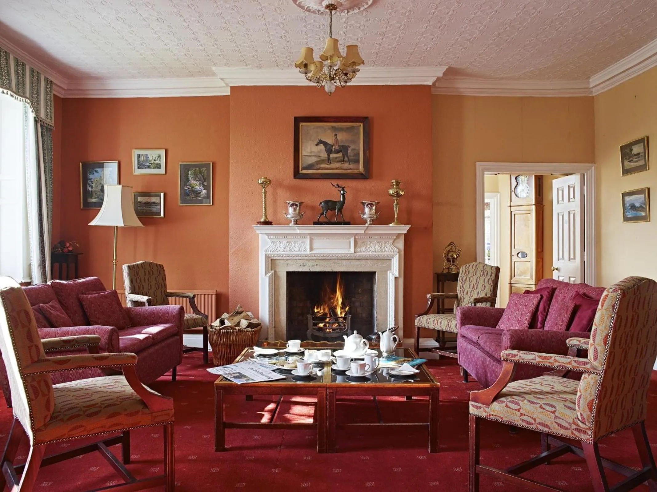 Communal lounge/ TV room in Corse Lawn House Hotel