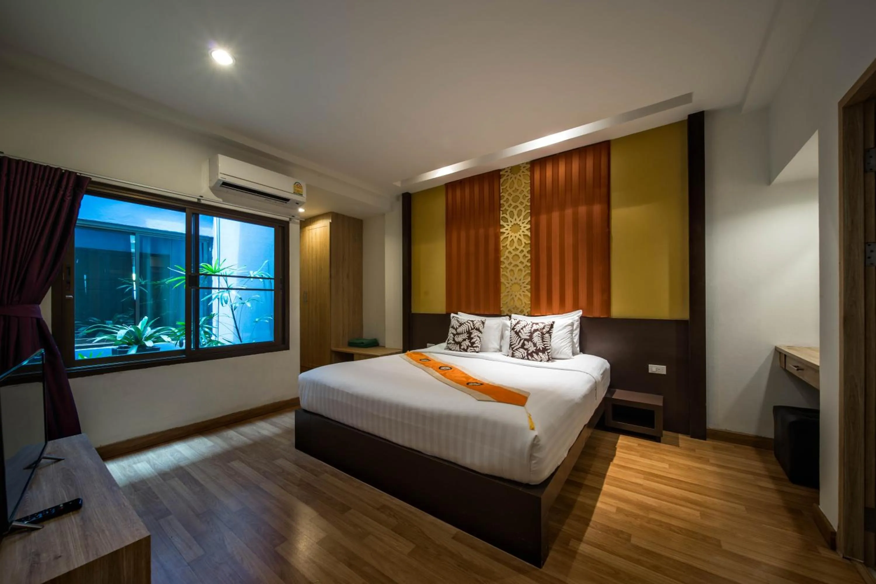 Bed in Kamala Beachfront Apartment