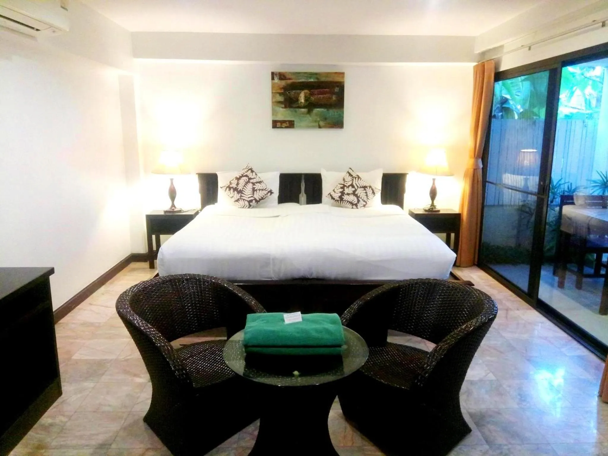 Bed in Kamala Beachfront Apartment