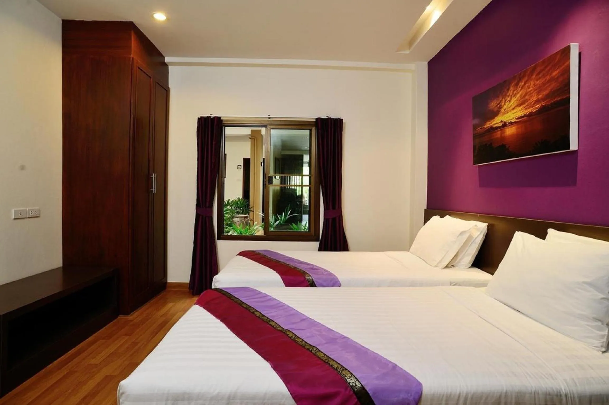 Bed in Kamala Beachfront Apartment