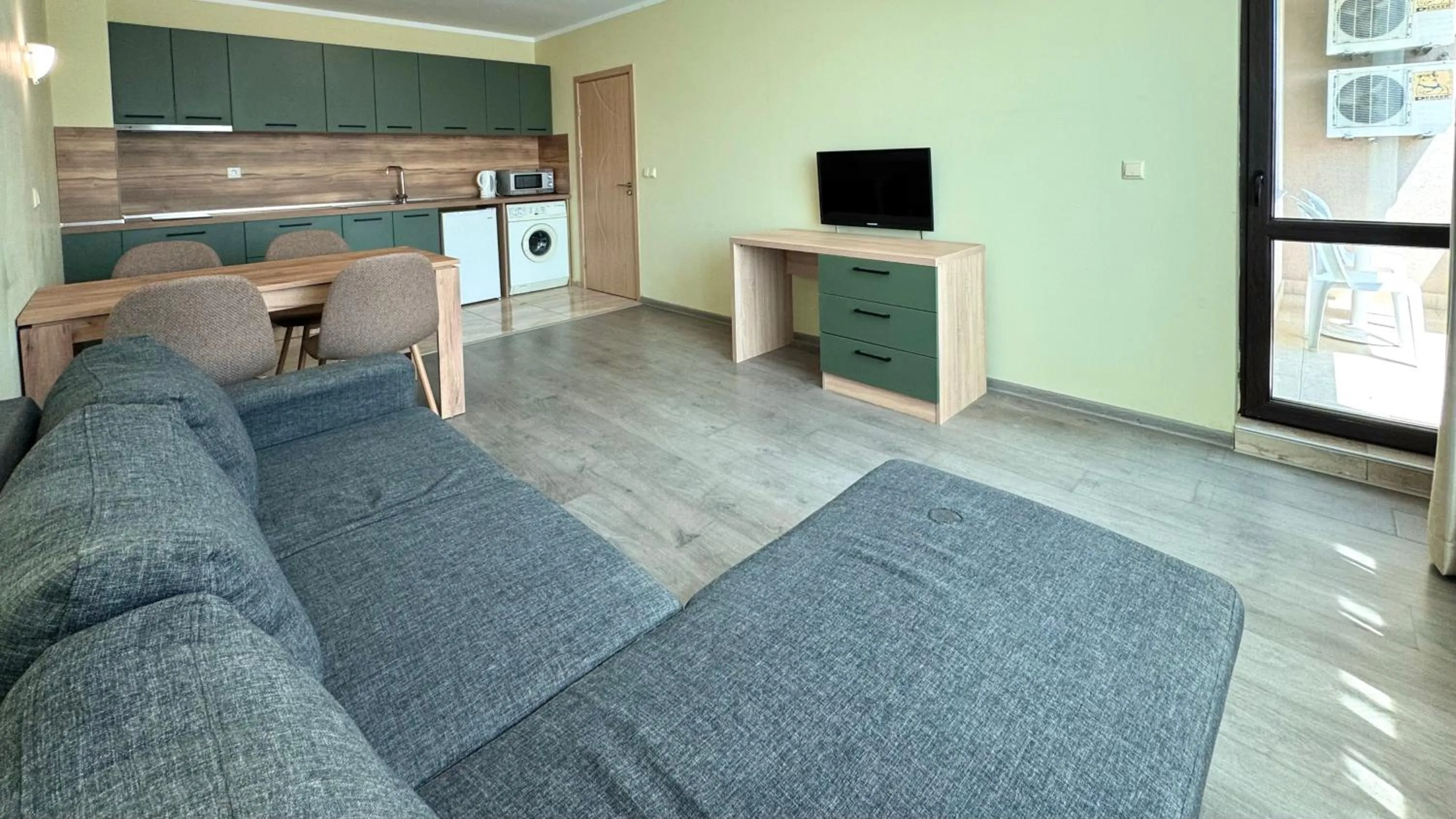 Communal lounge/ TV room in Evi Apartments 2