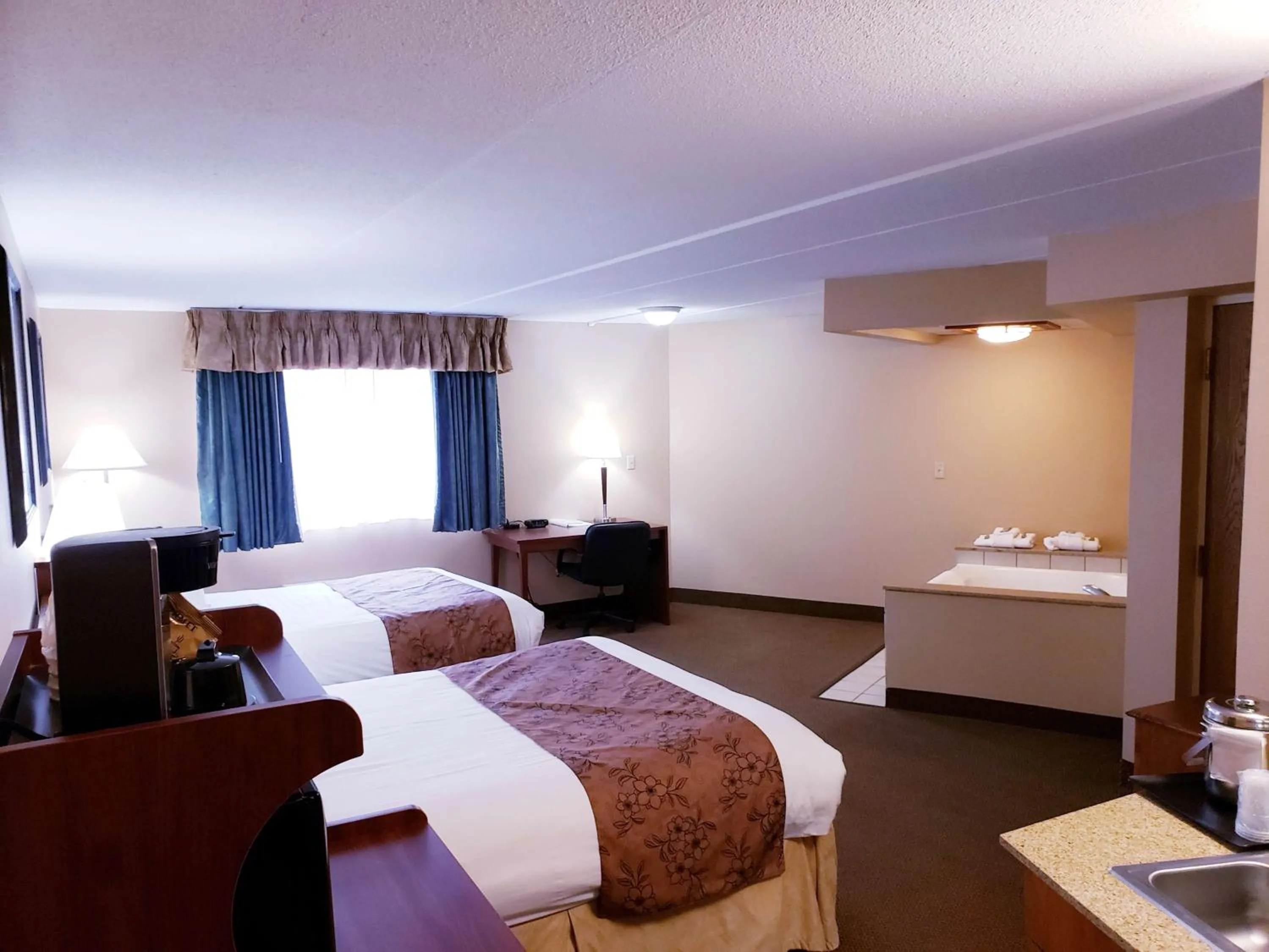 Photo of the whole room, Bed in SureStay Plus Hotel by Best Western Black River Falls