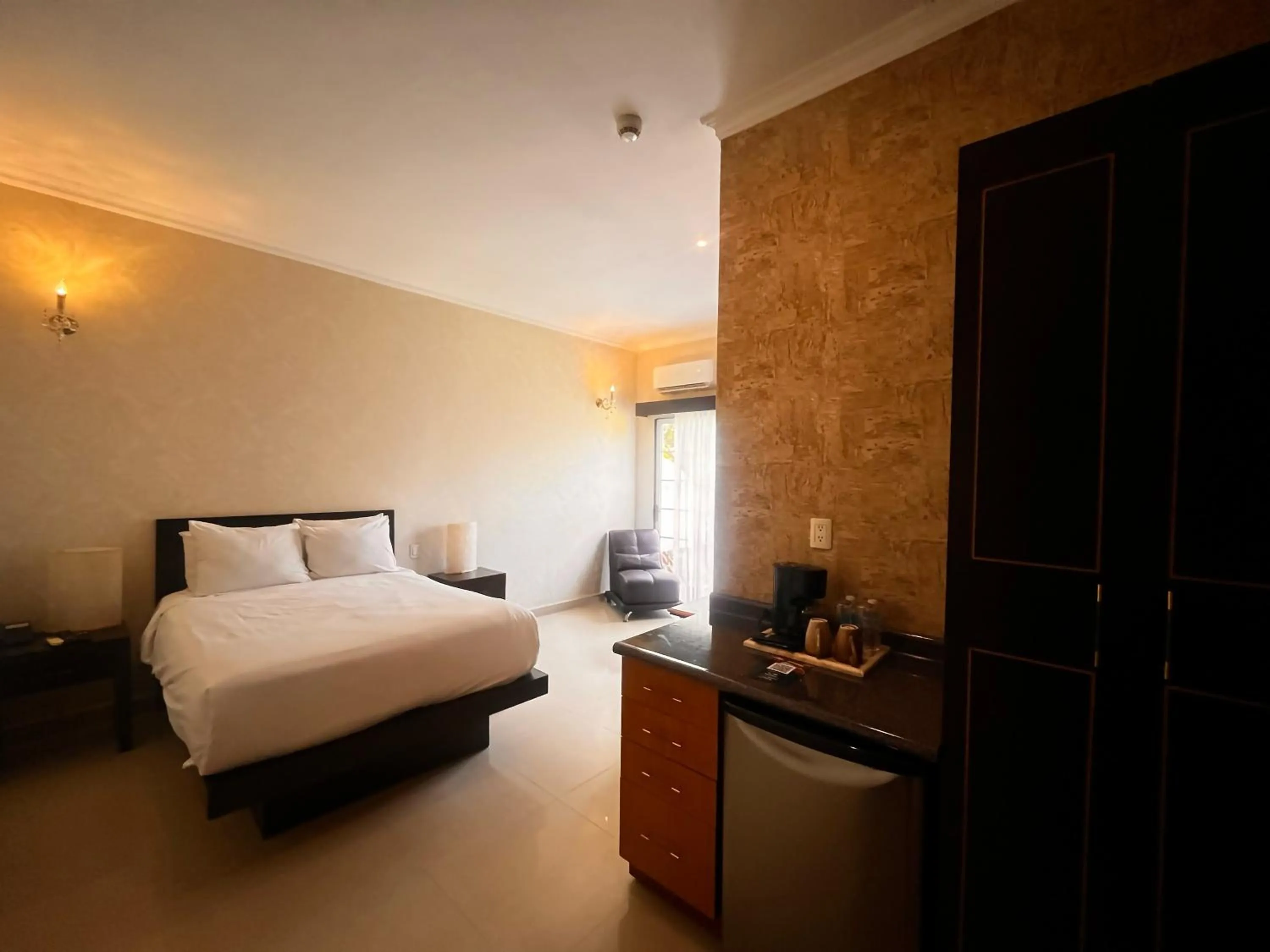 Bed in Hotel Palacio Maya