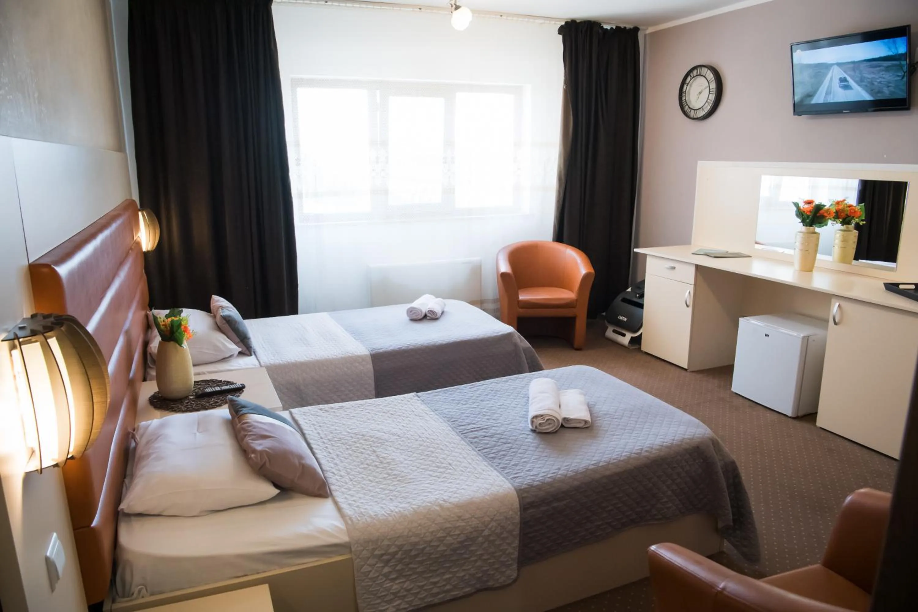 Bed in MBI Travel Inn