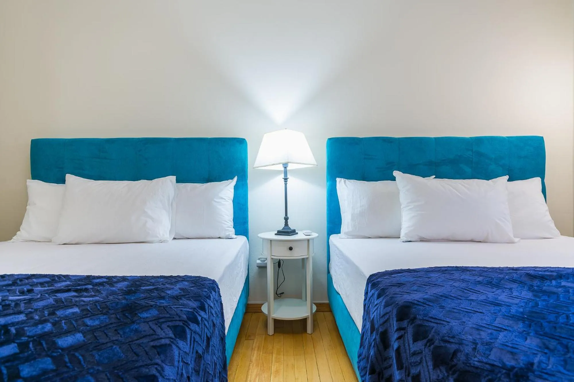 Bed in Victoria Queens Paradise Apartments