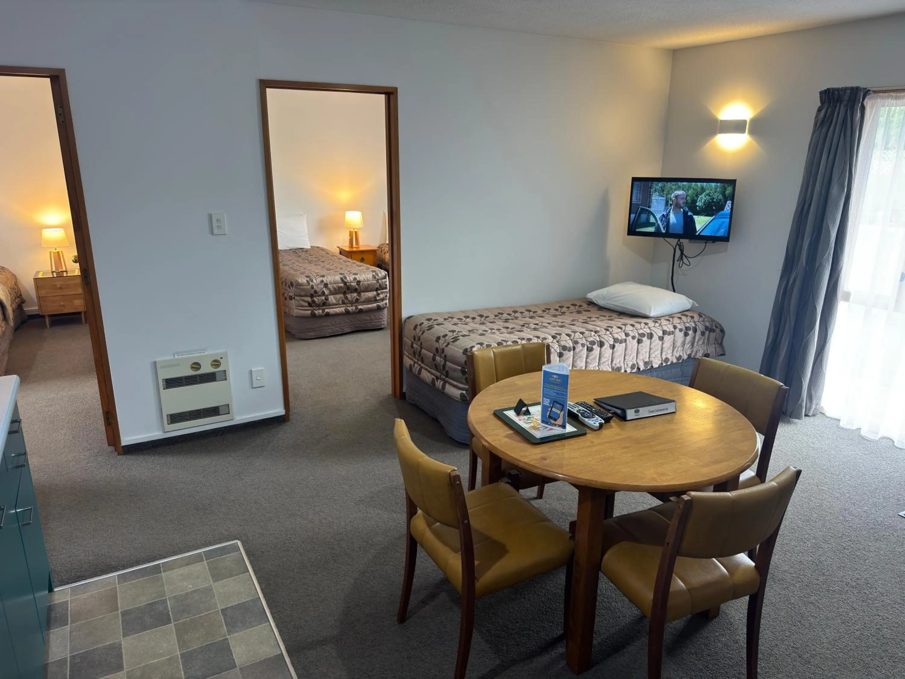 Bed in ASURE Ambassador Motor Lodge