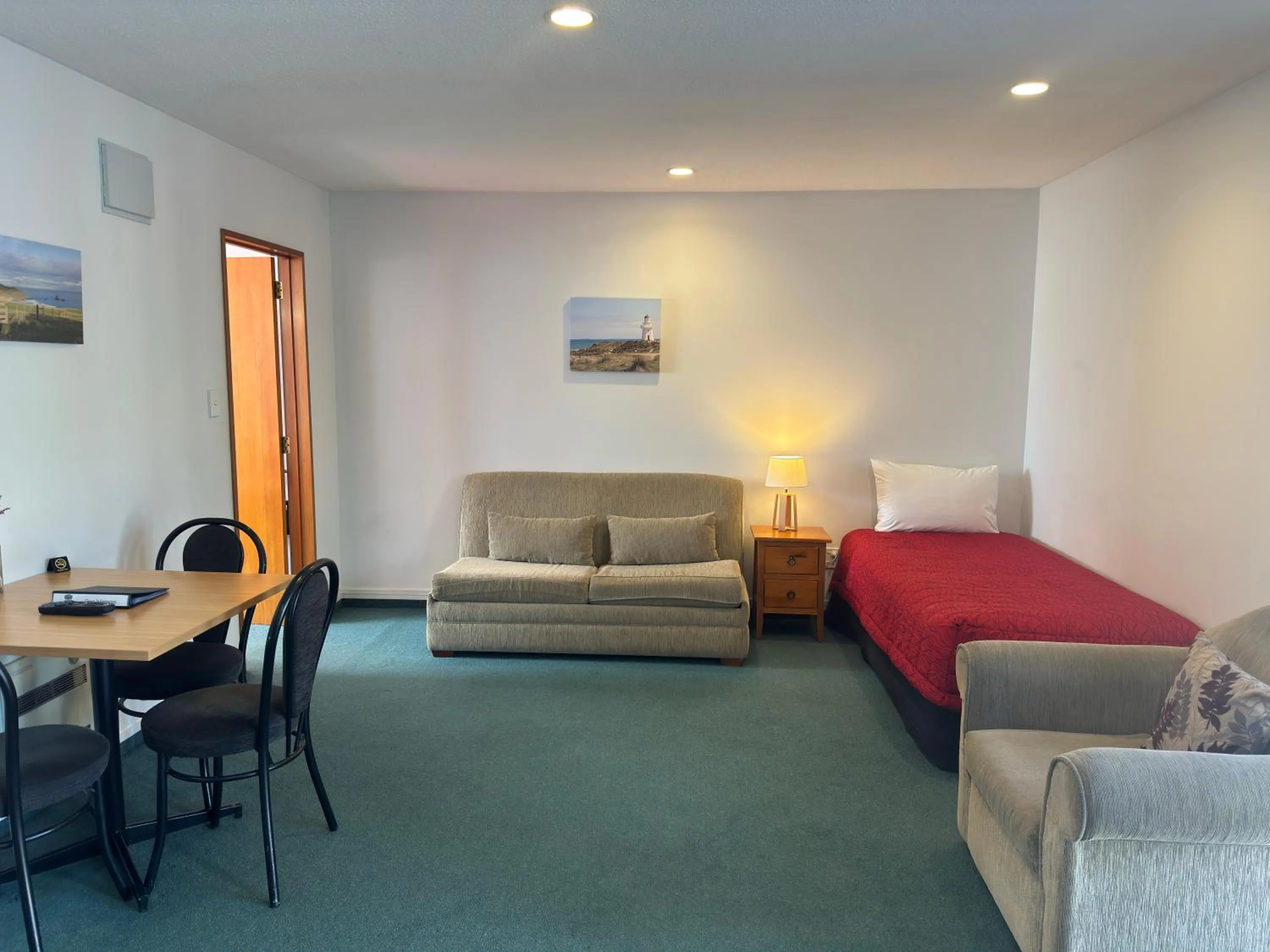 Living room in ASURE Ambassador Motor Lodge