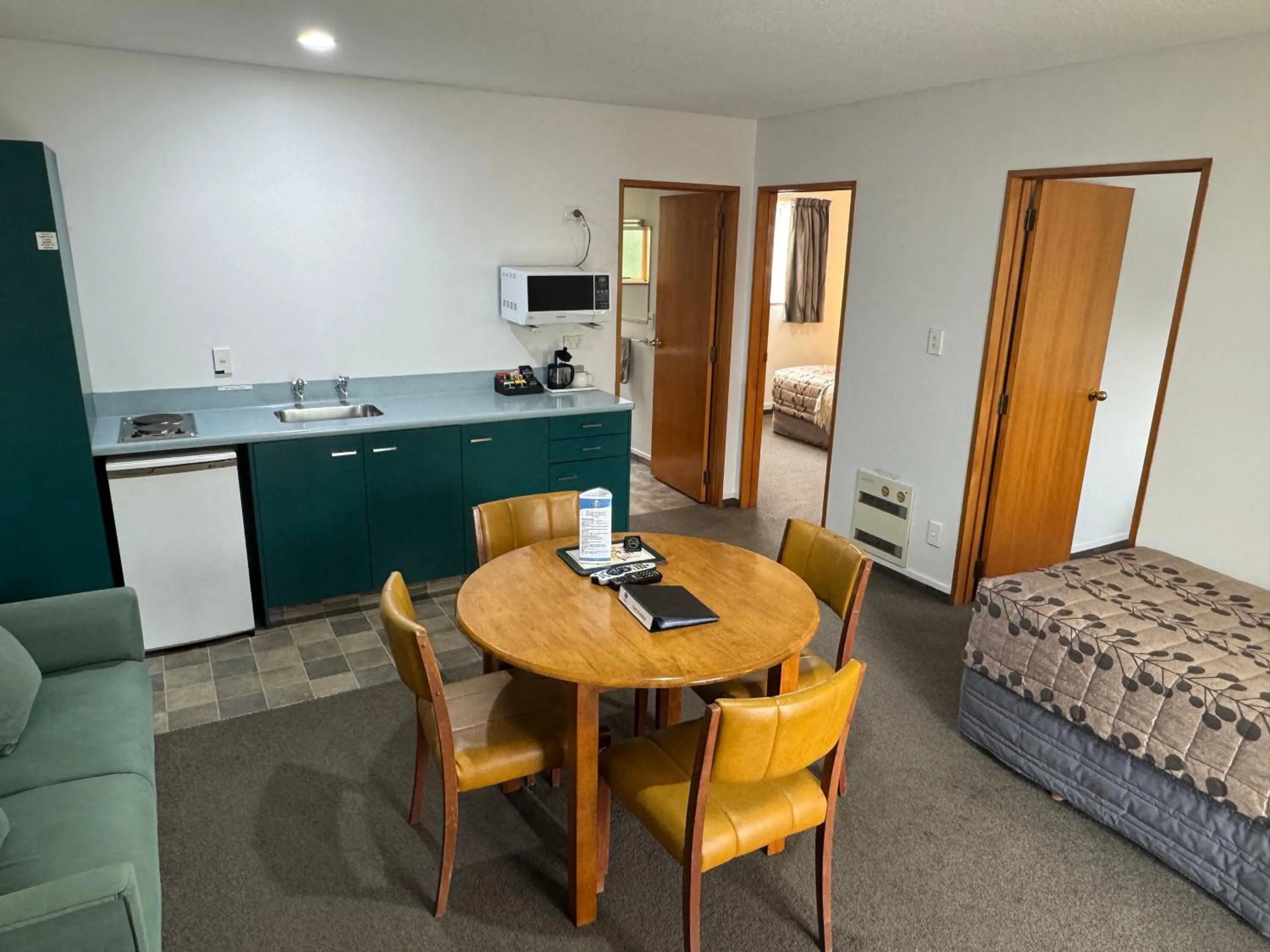 Bed in ASURE Ambassador Motor Lodge