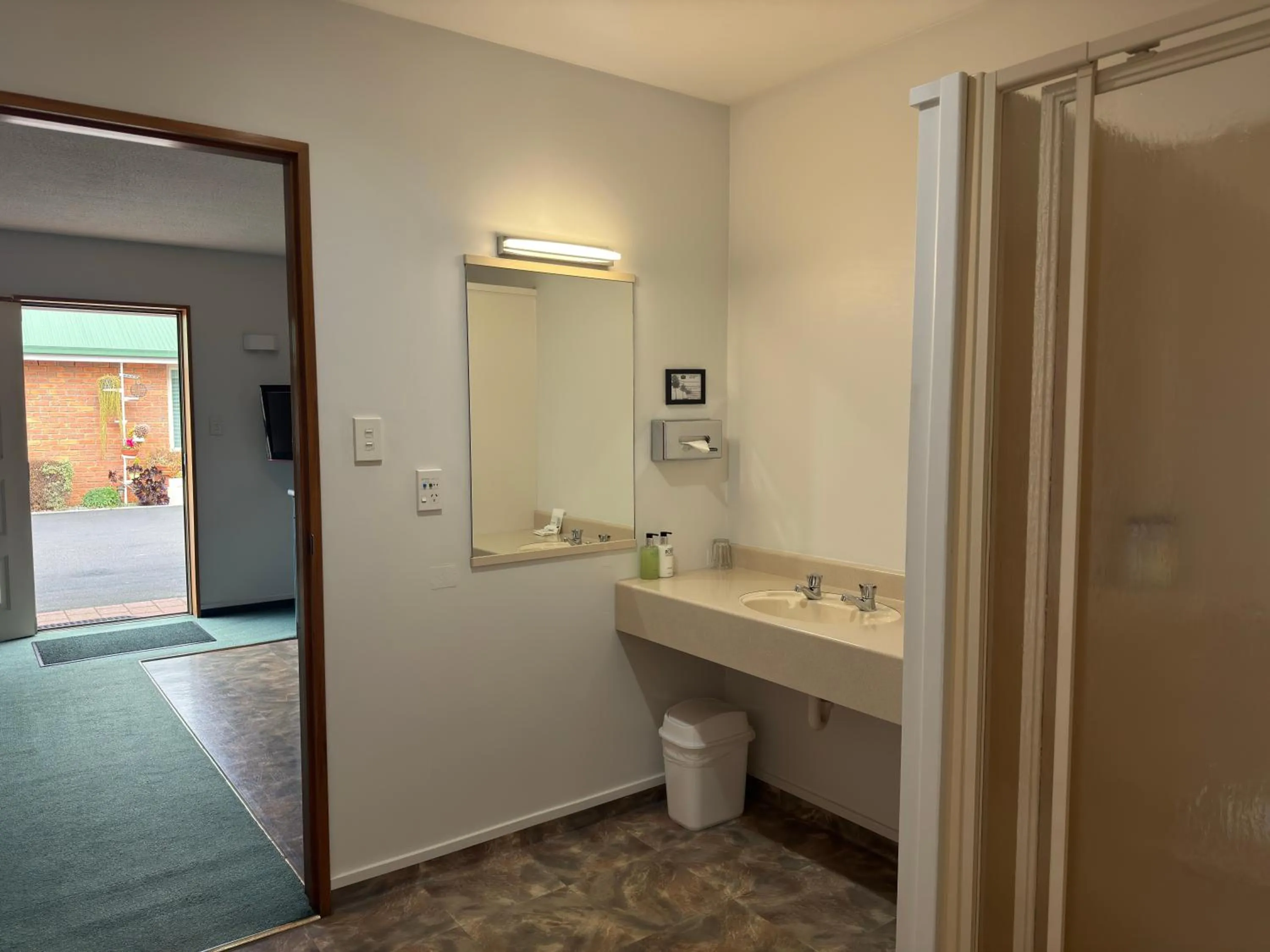 Bathroom in ASURE Ambassador Motor Lodge