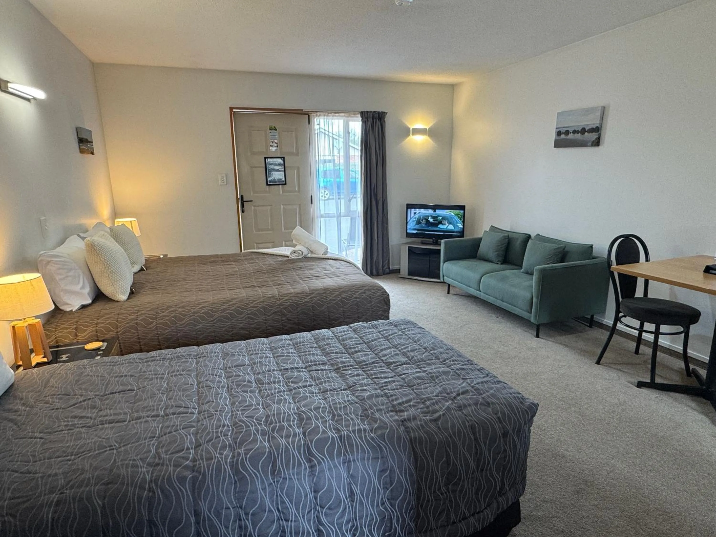 Bed in ASURE Ambassador Motor Lodge