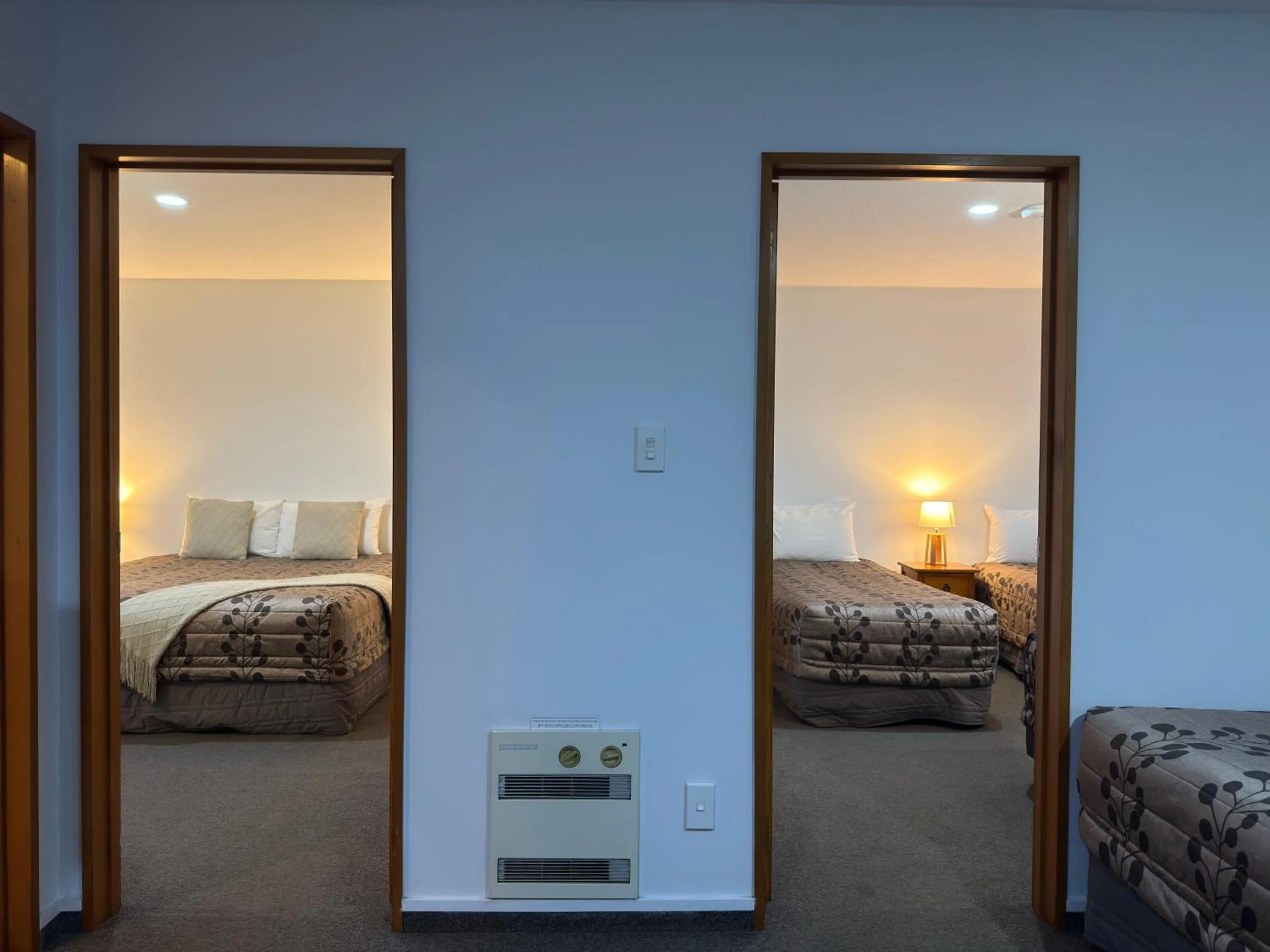 Bed in ASURE Ambassador Motor Lodge