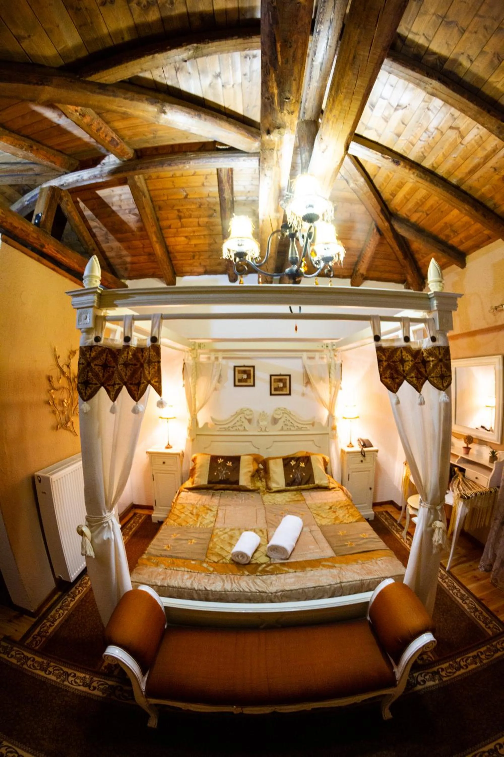 Bed in La Moara Boutique Hotel