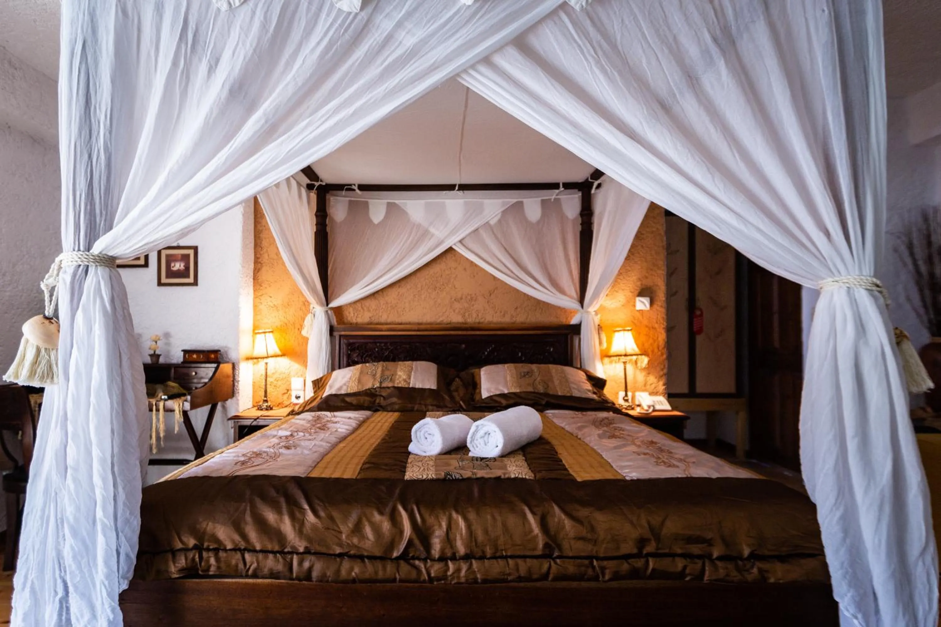 Bed in La Moara Boutique Hotel