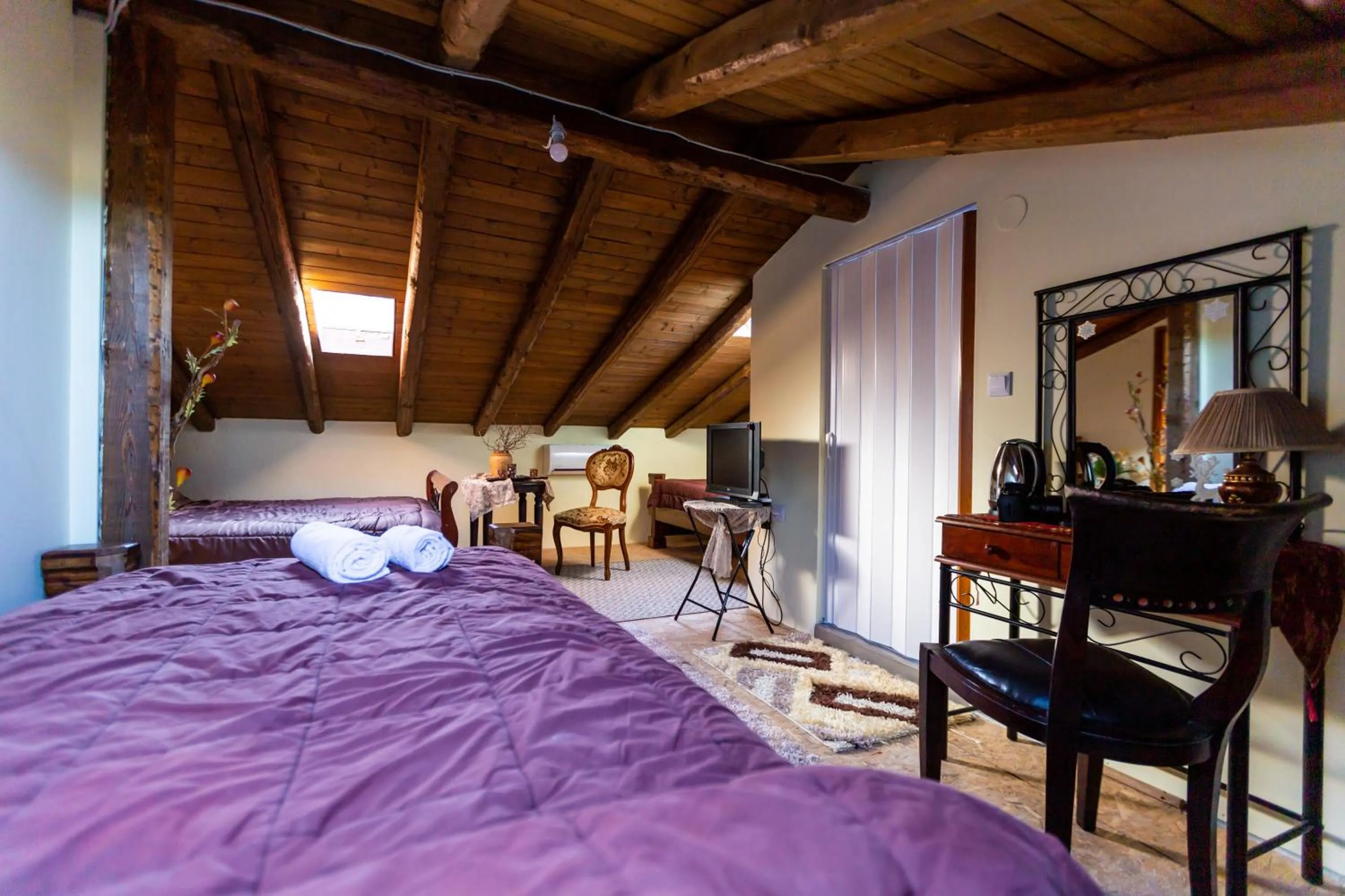 Bed in La Moara Boutique Hotel