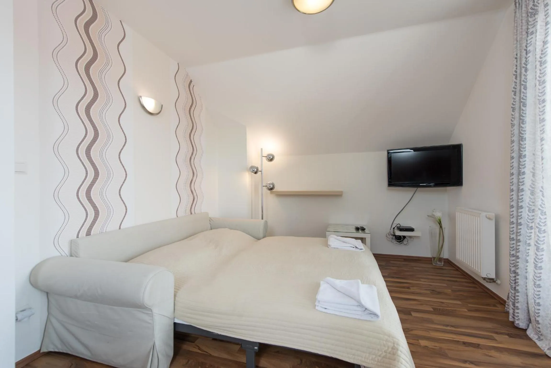 Living room, Bed in Hotel Garni Pod Skalkou