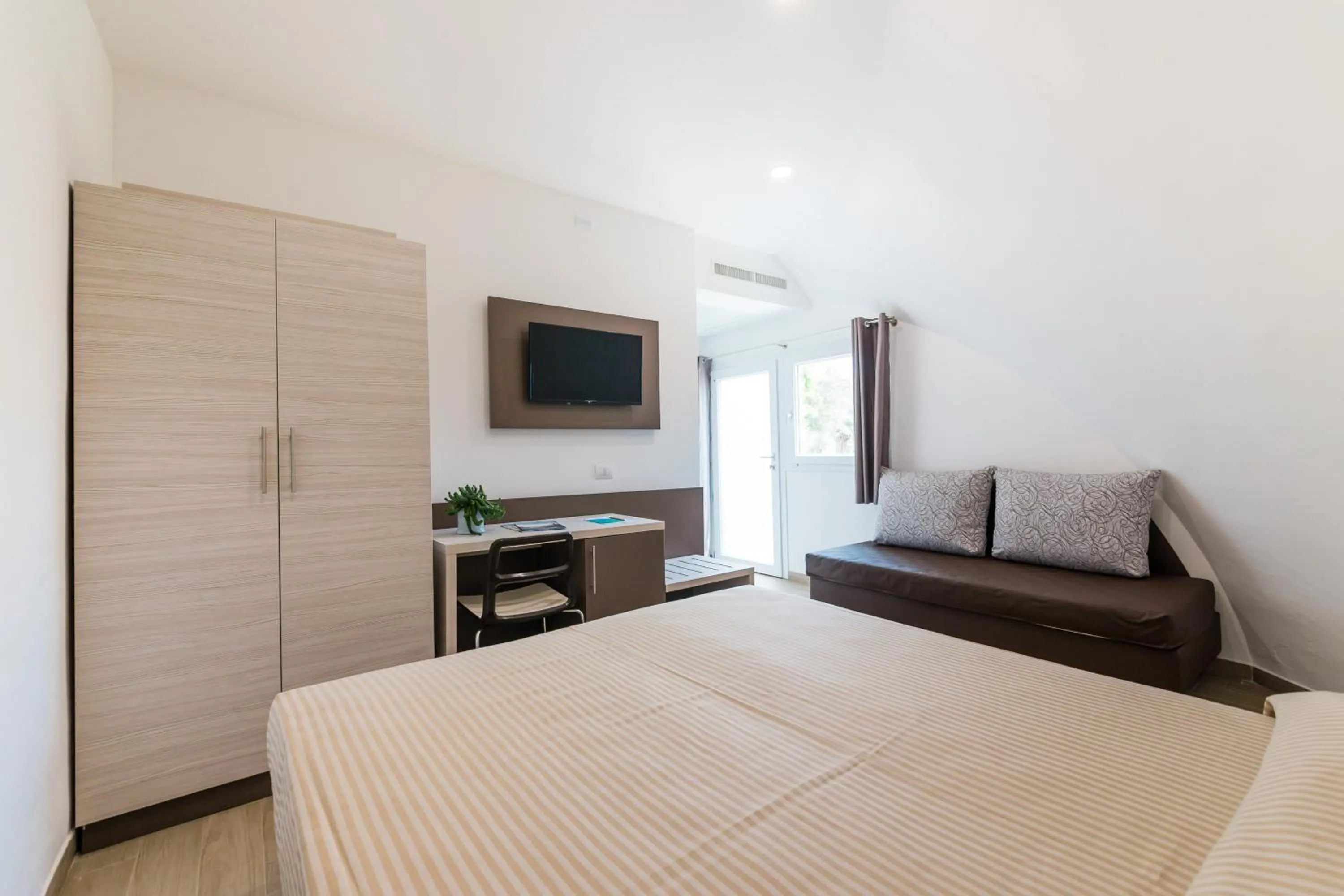 Photo of the whole room, Bed in Torre Cintola Greenblu Sea Emotions