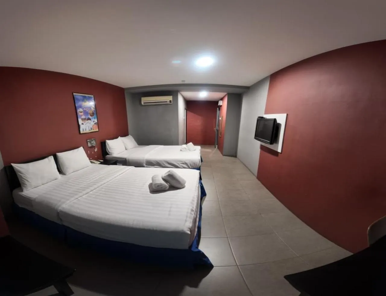 Bed in Metroinn Hotel