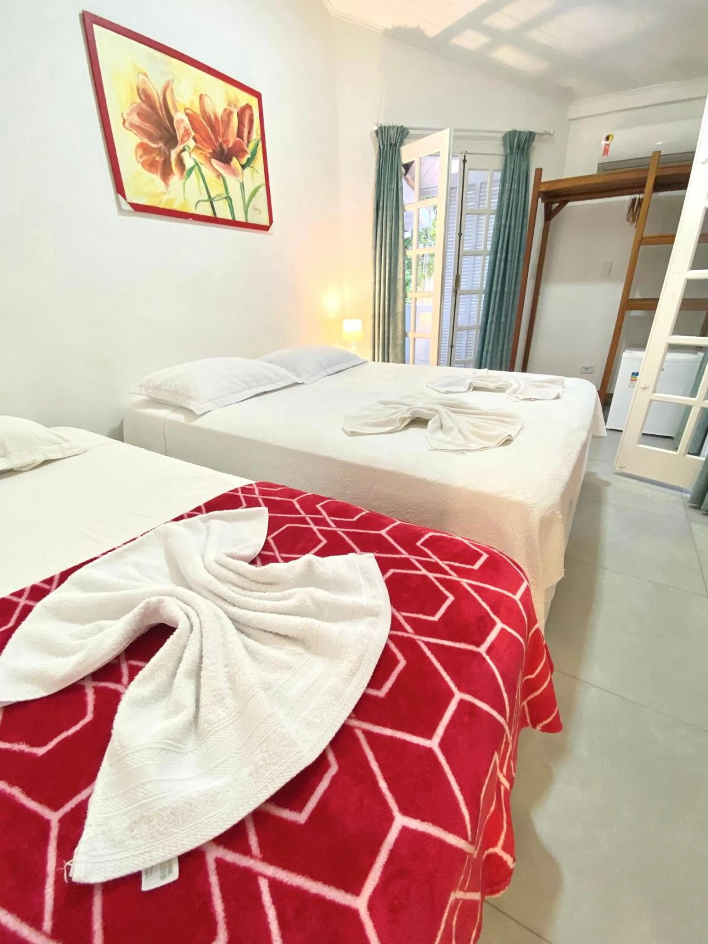 Bed in Pousada Tô na Praia Juquehy