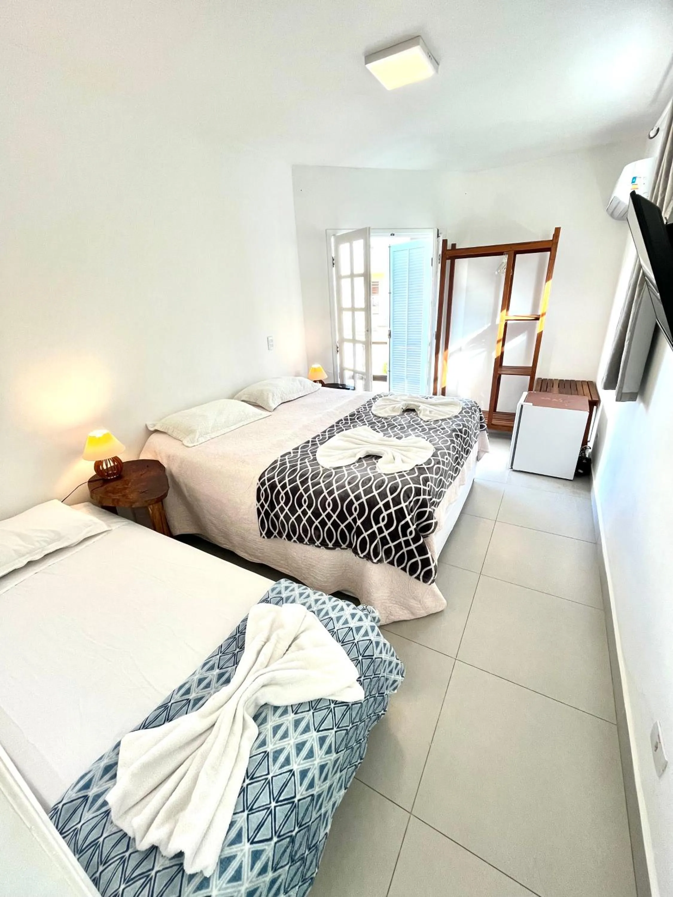 Bed in Pousada Tô na Praia Juquehy