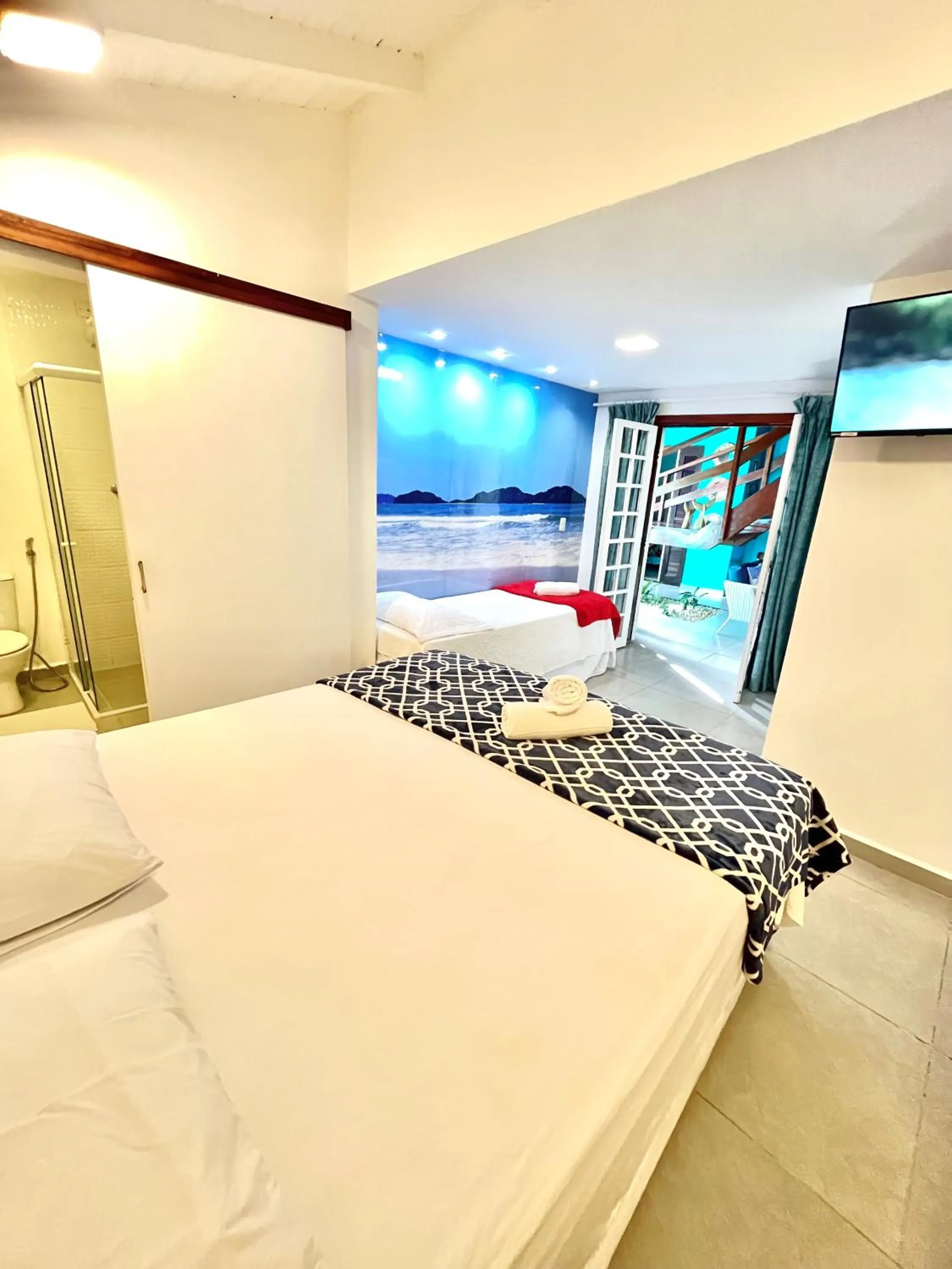 Bed in Pousada Tô na Praia Juquehy